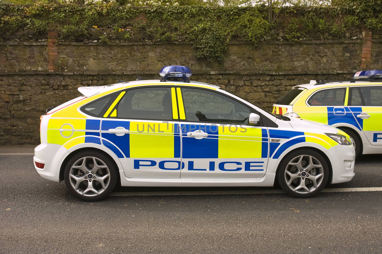 scenes from the accident on the A35 in the village of Chideock with Dorset police cars