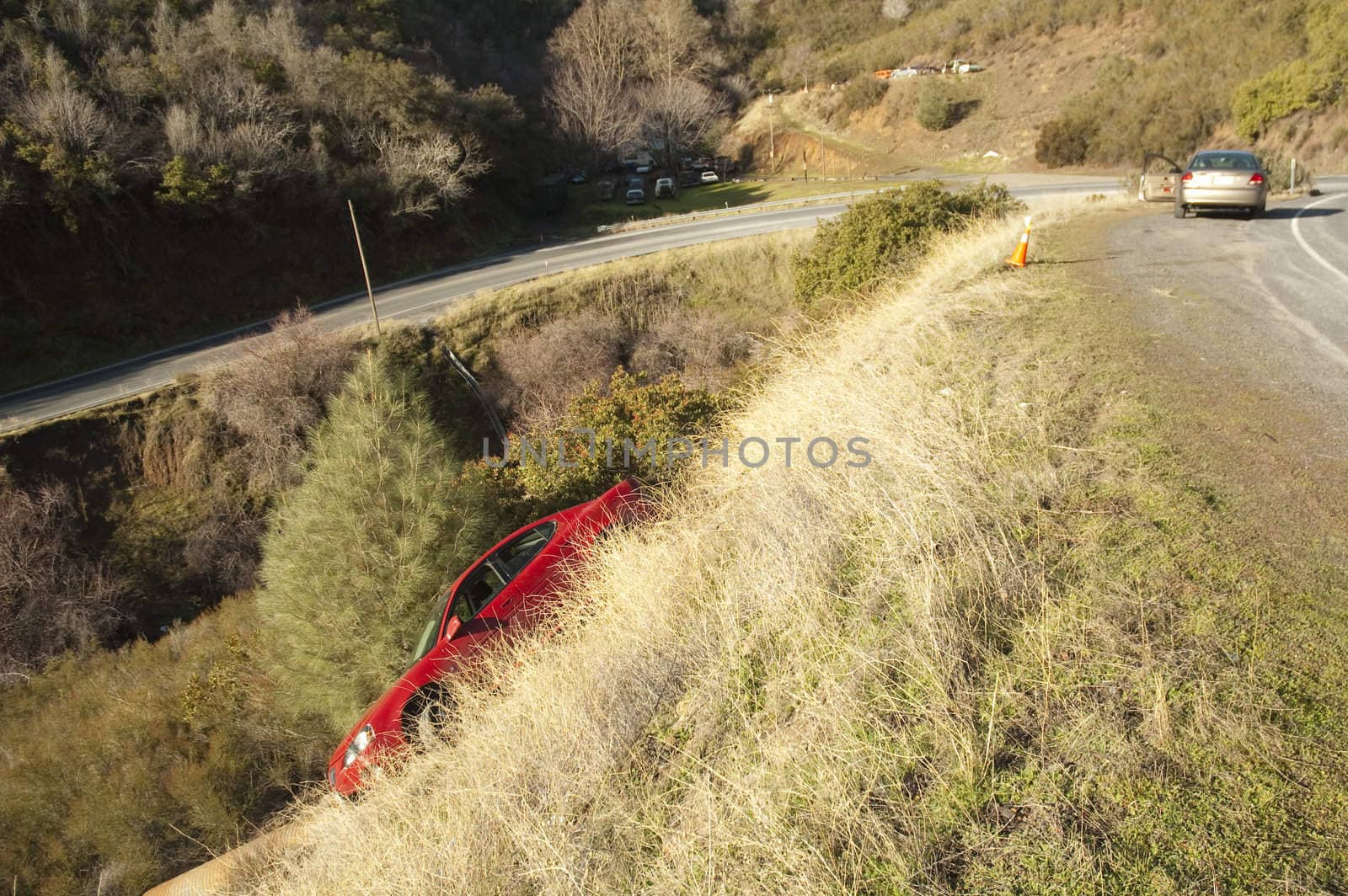 automobile slid off the road on a steep bend in the mountains