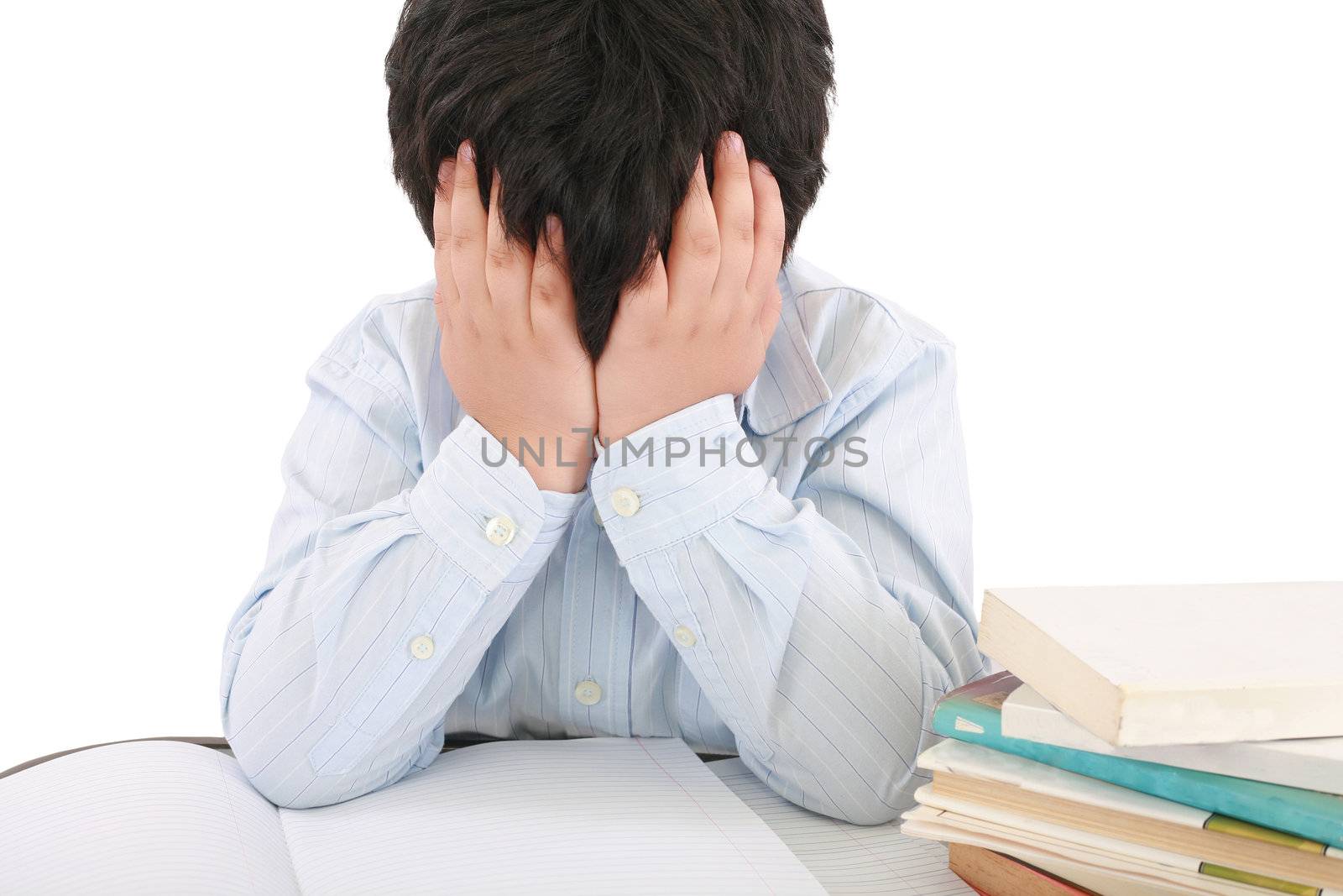 Schoolboy being stressed by his homework, isolated on white background