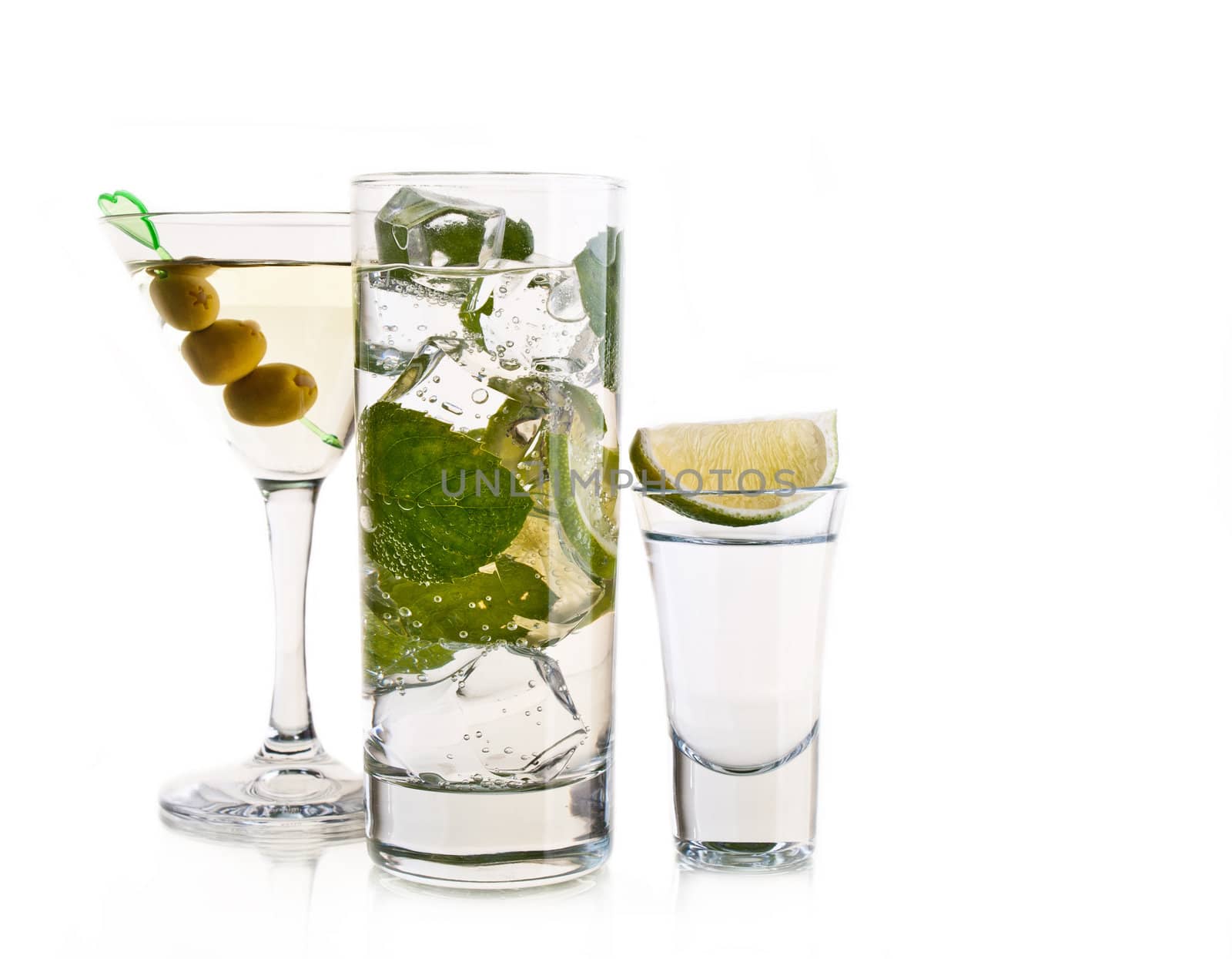 Various cocktails and alcohol on white background