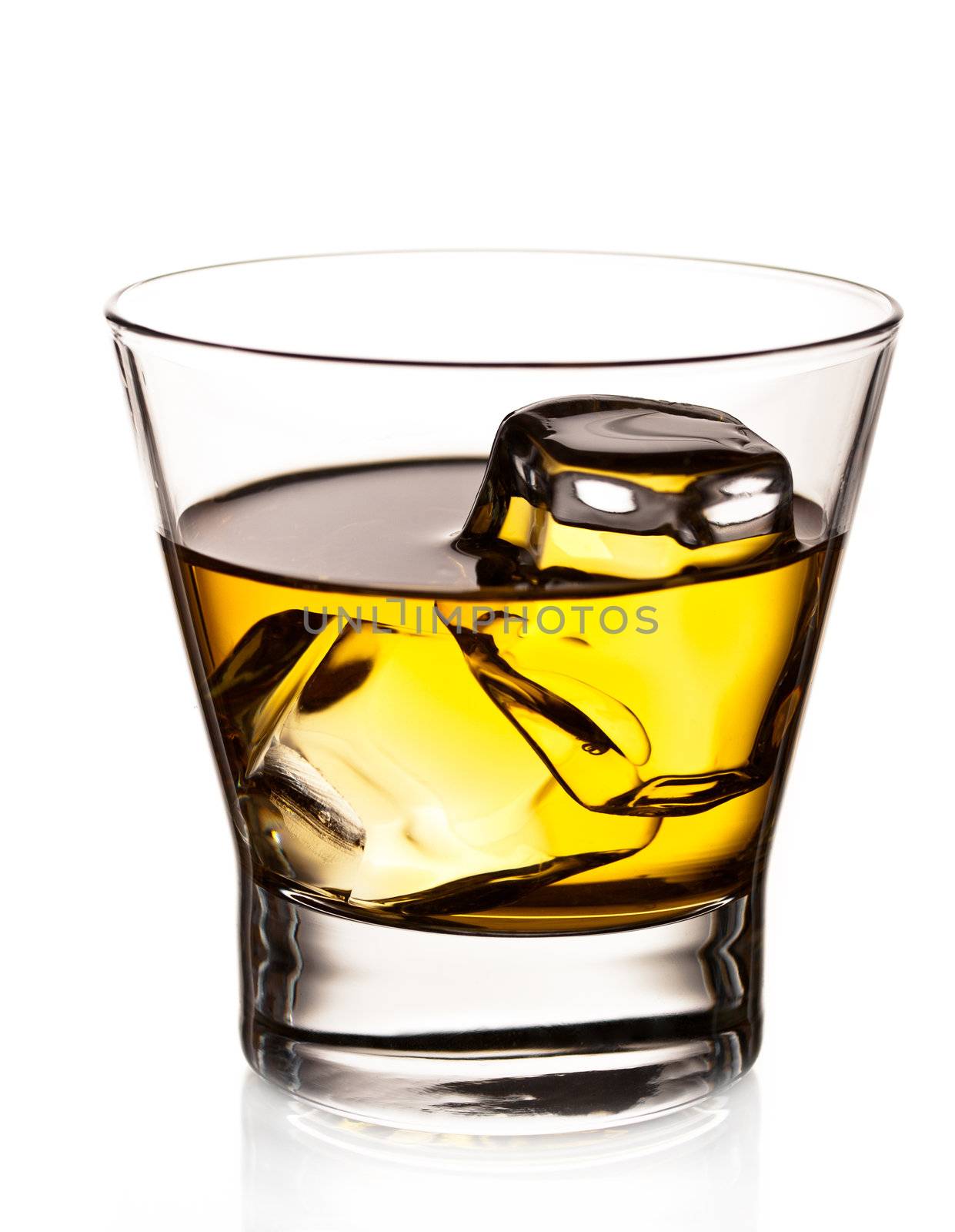 Whiskey on the rocks in an old fashion glass isolated on white