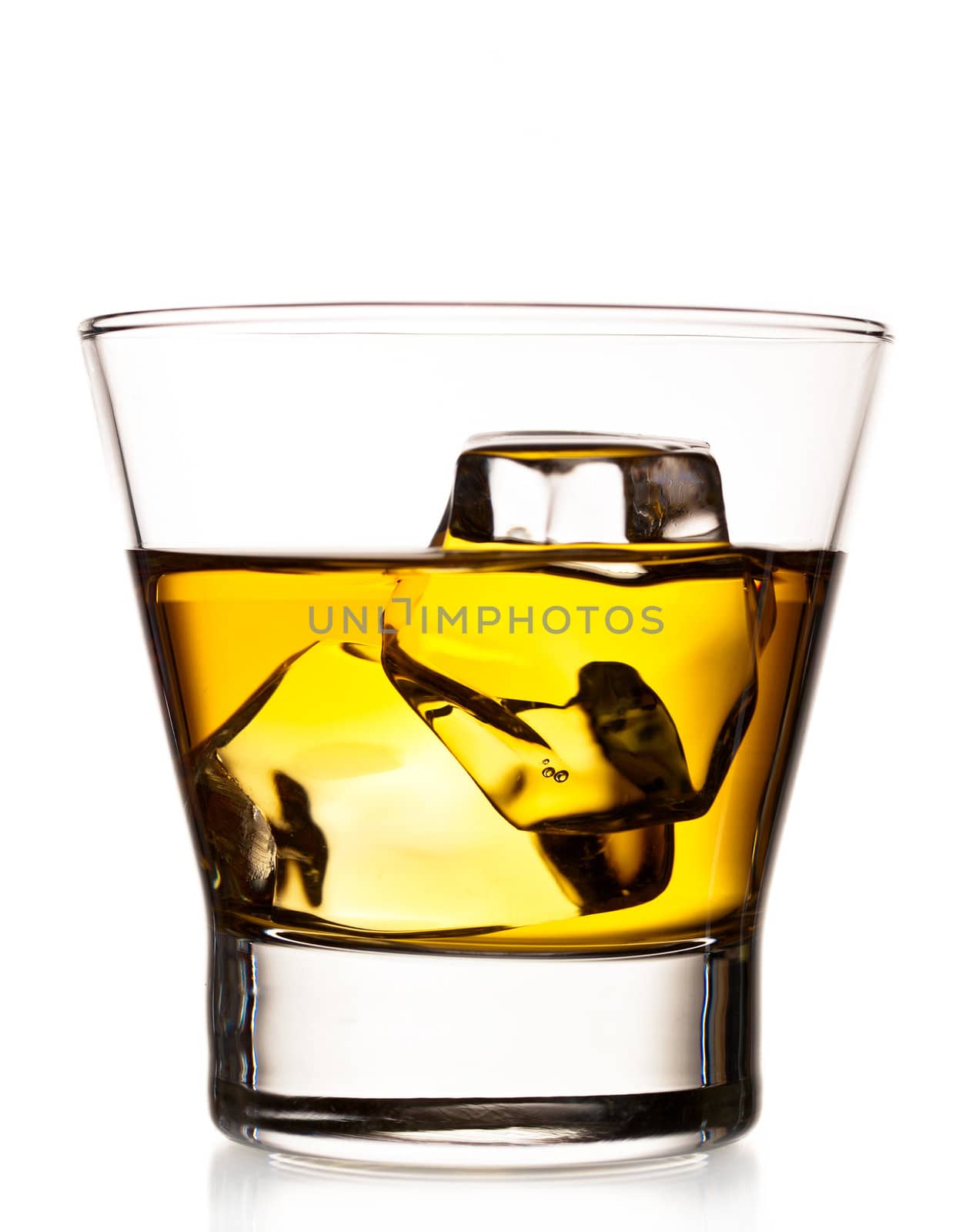 Whiskey on the rocks in an old fashion glass isolated on white