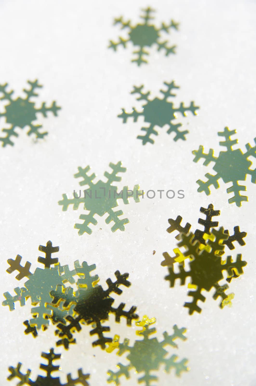 golden snow stars on a real snowy icy surface