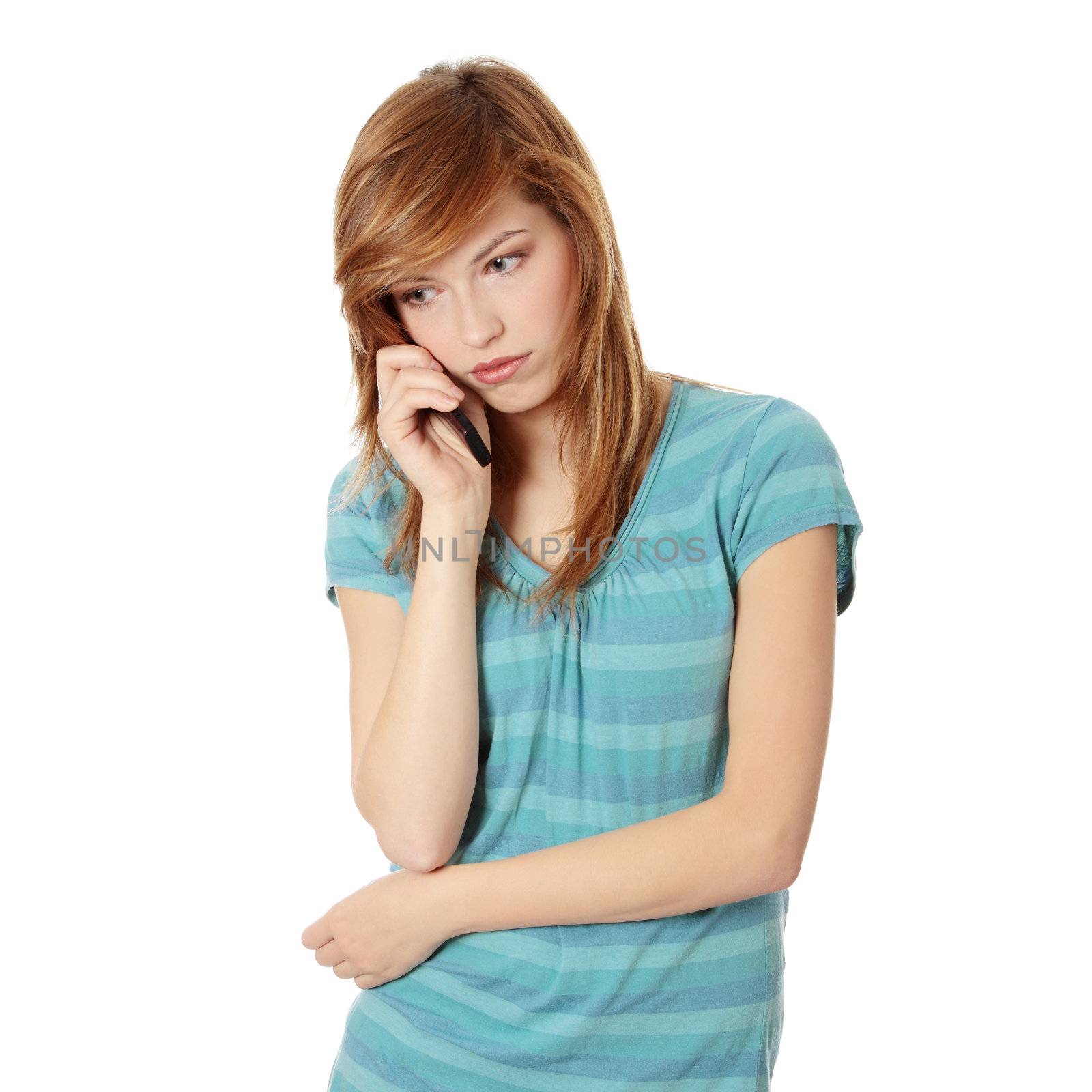 Young woman getting bad news by phone by BDS