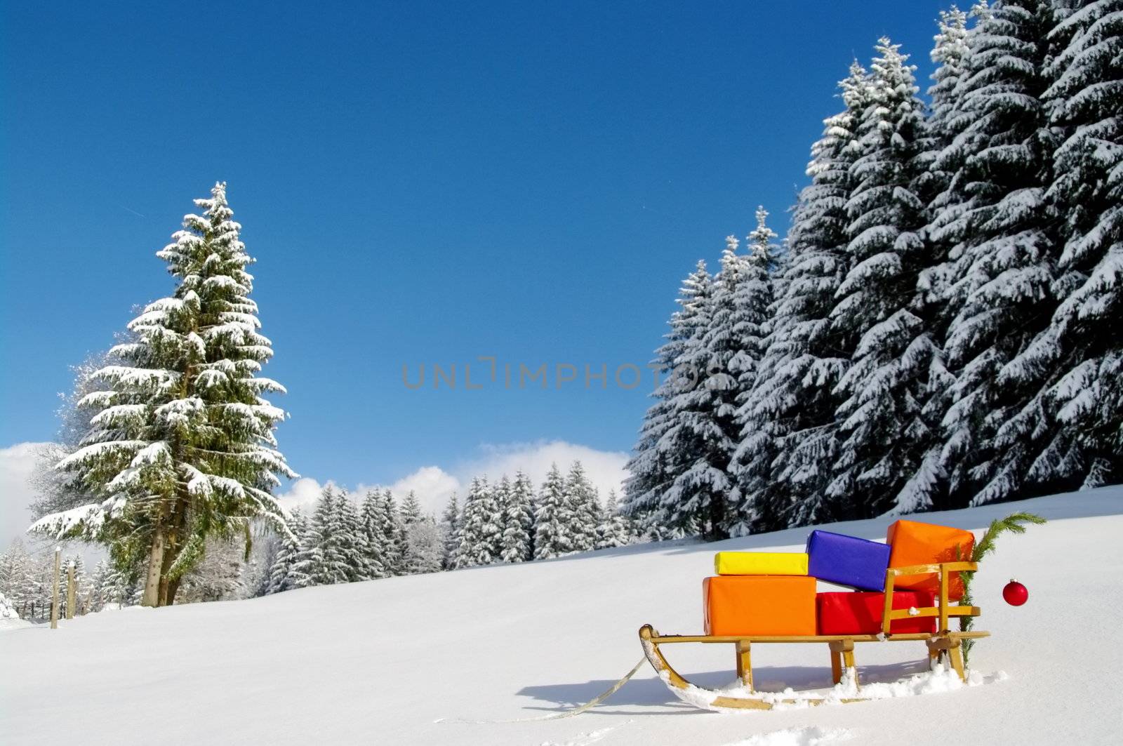 colorful presents on a Santa Claus sledge in a winter landscape