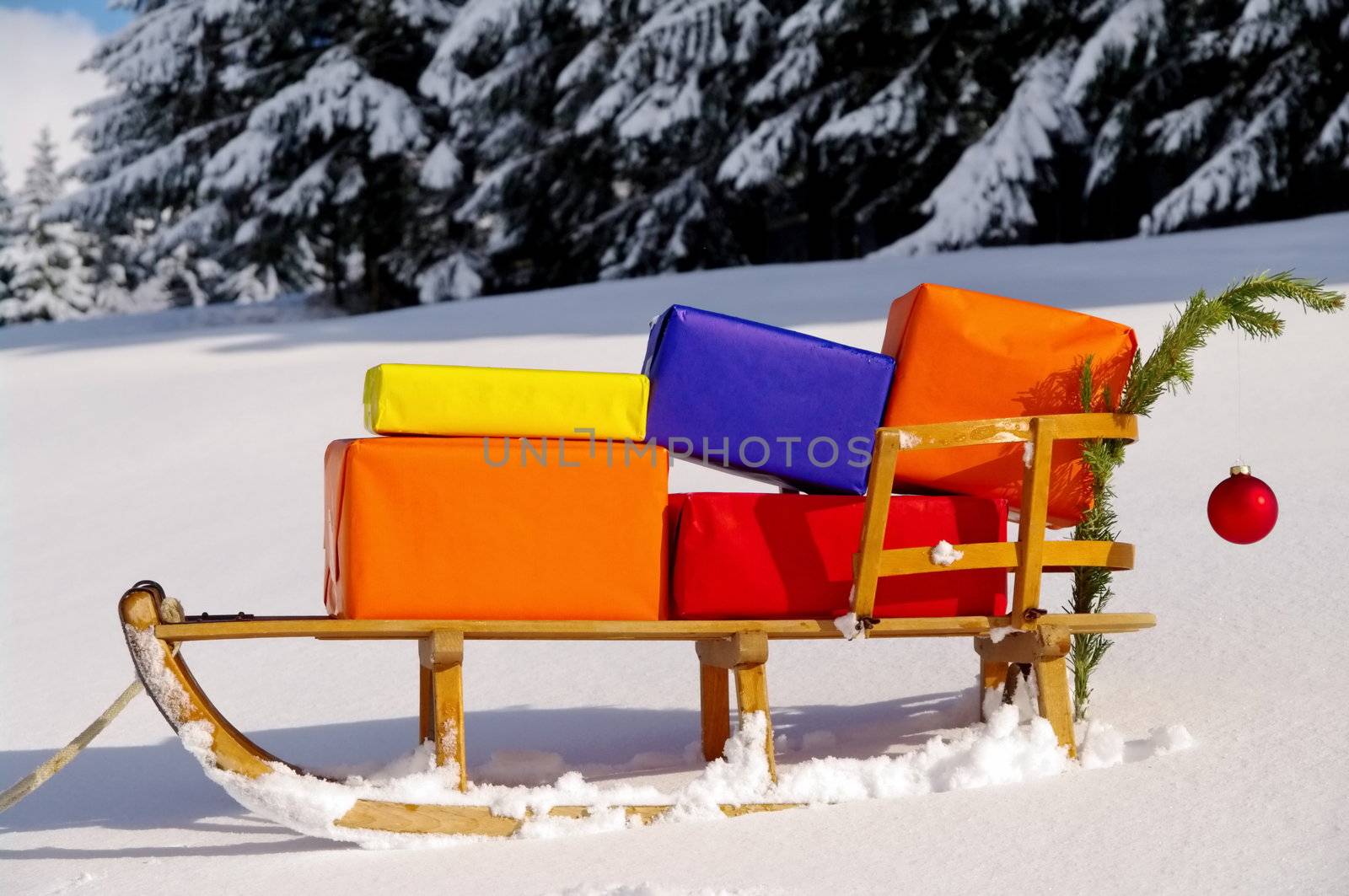 colorful presents on a Santa Claus sledge in a winter landscape