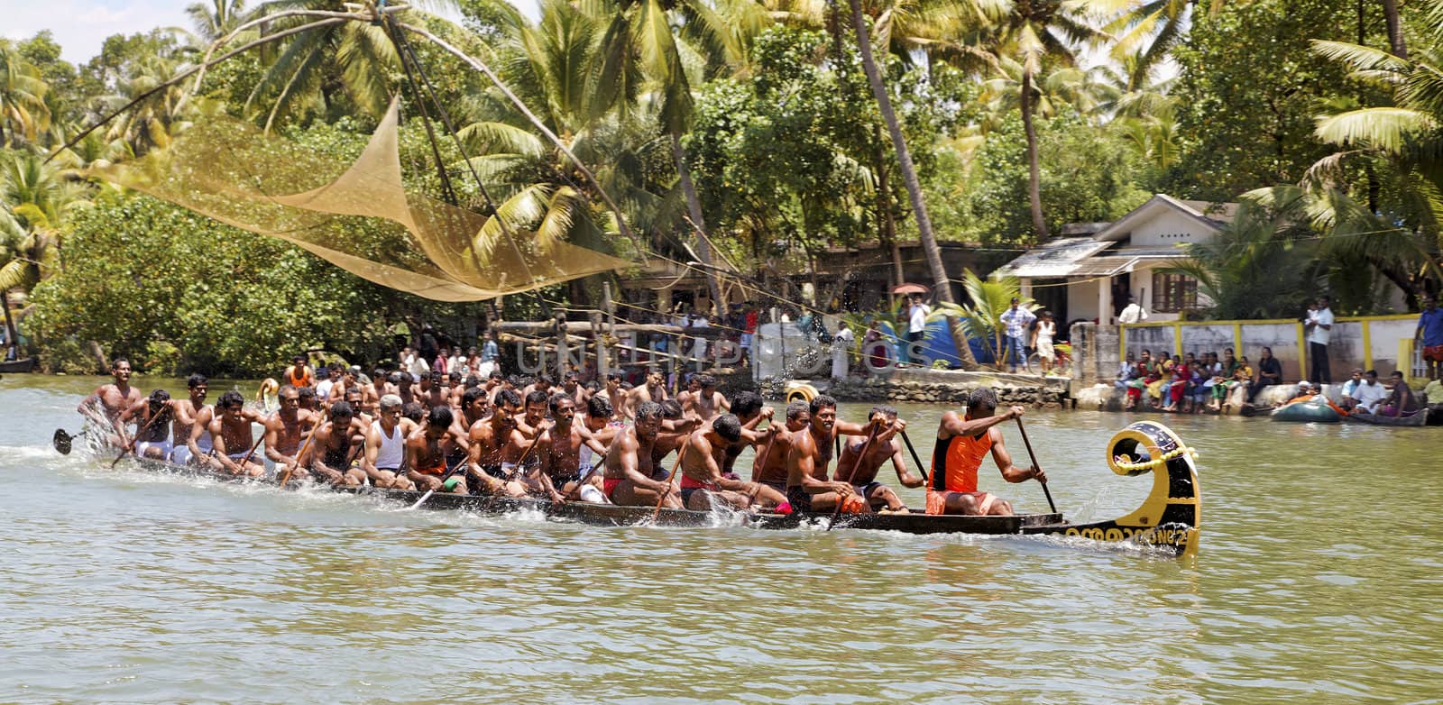 North Paravoor, Gothuruth, Kerala, India, Asia - September 25th, 2011: Gothuruth Boat Race two snake boats racing to the finish line, crop margin copy space horizontal landscape
