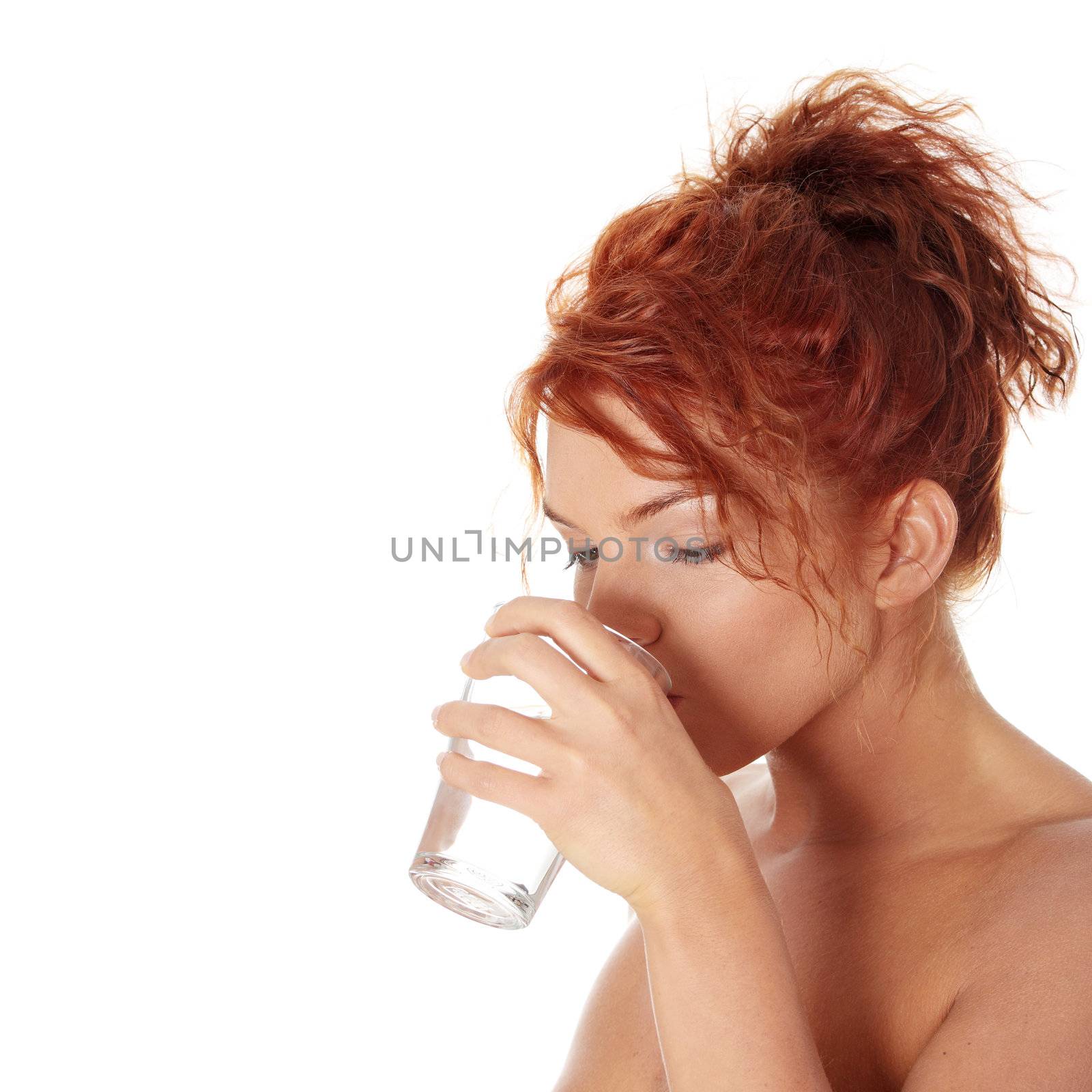 Young caucasian woman drinking water from glass, isolated on white