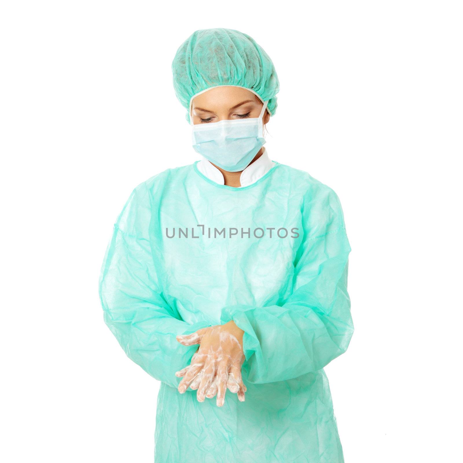 Female surgeon washing her hands by BDS