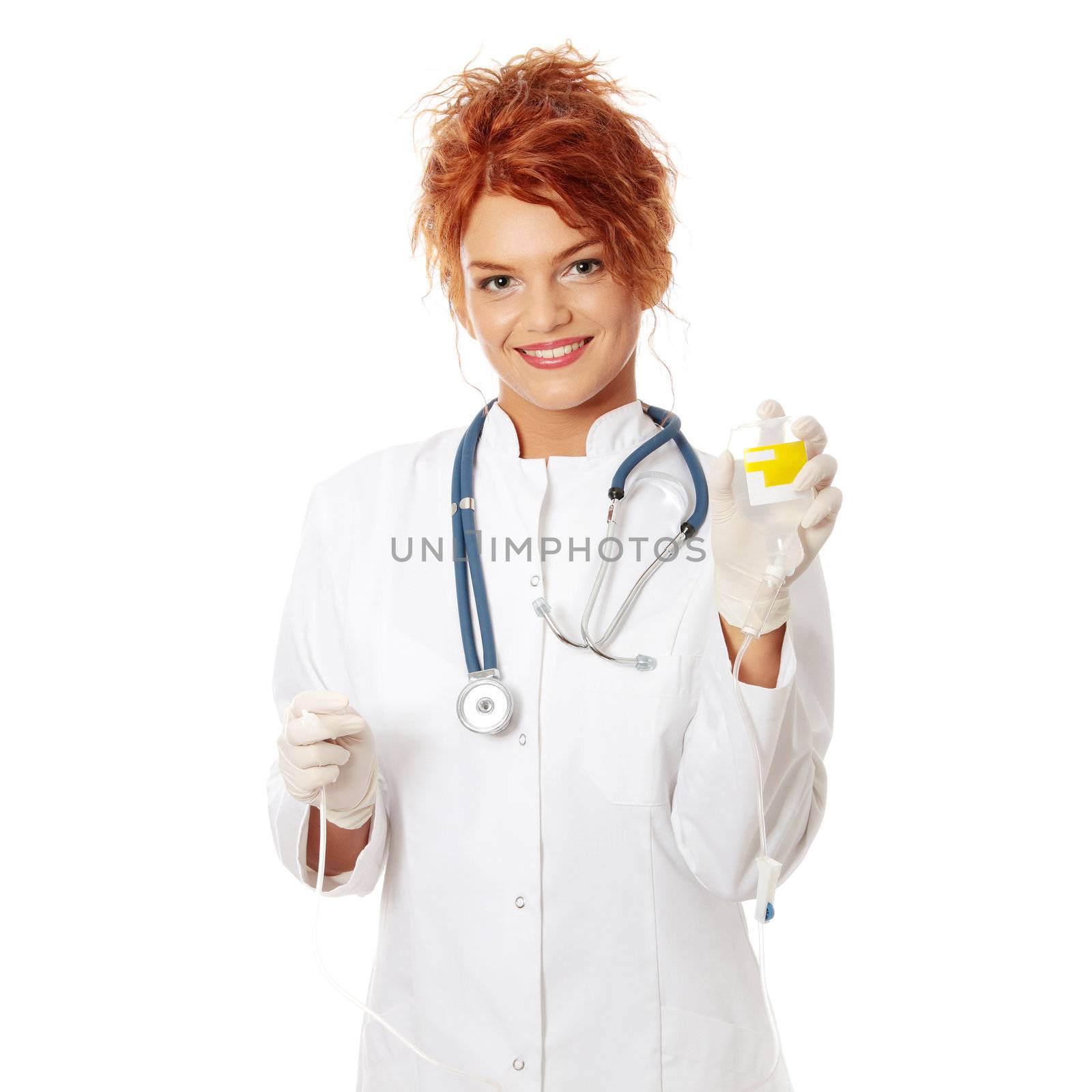 Portrait of a nurse making a drip, isolated on white