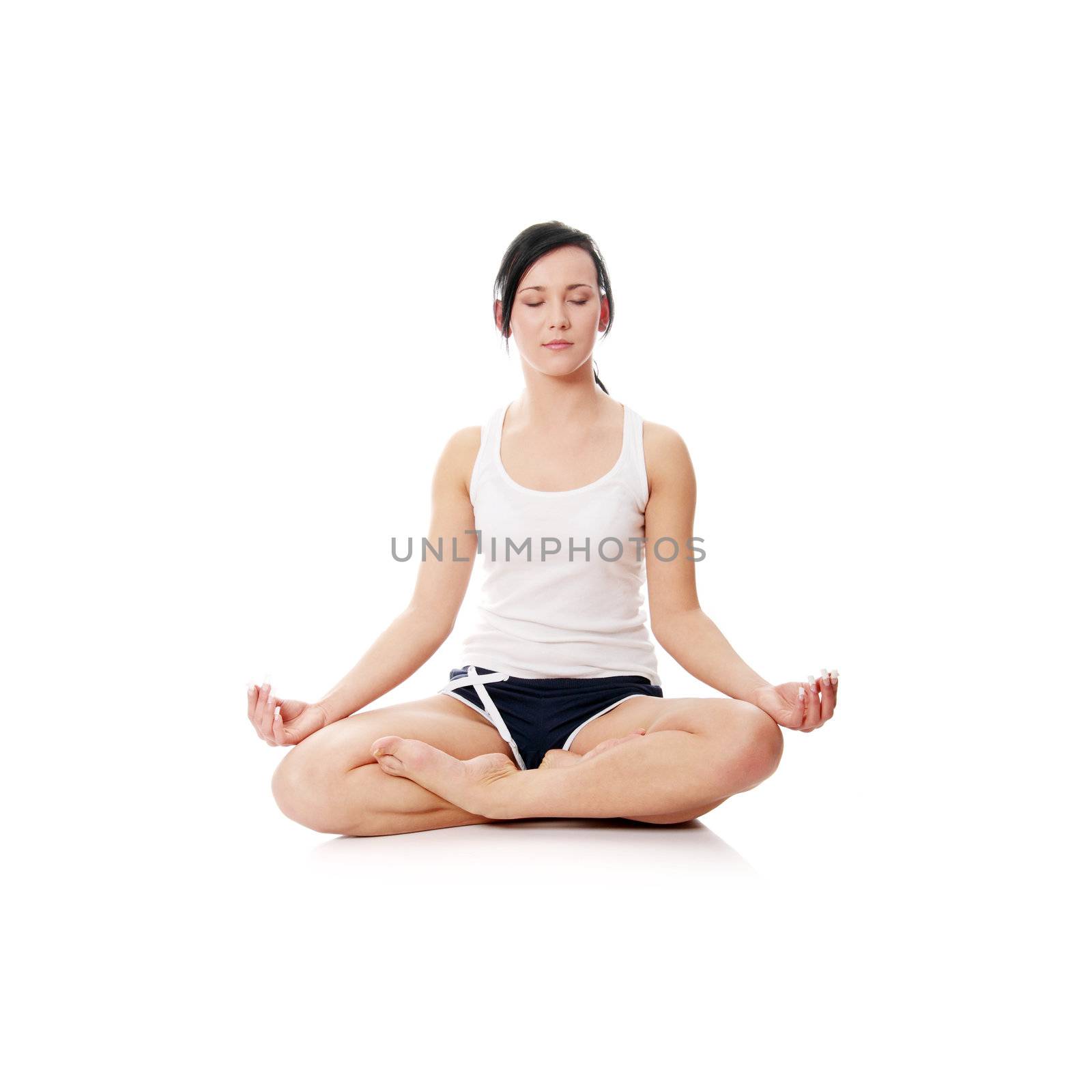 Young woman doing yoga by BDS