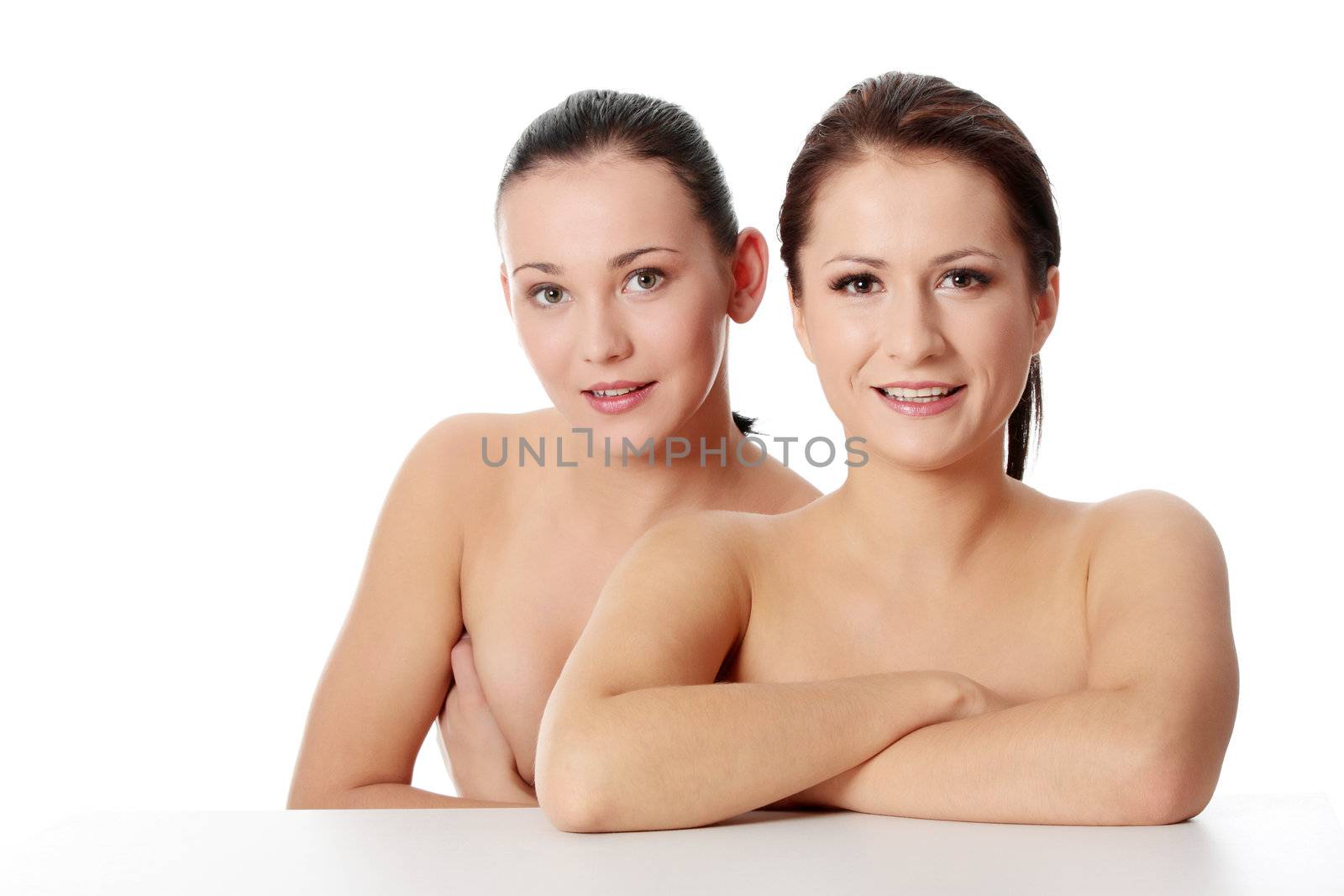 Portrait of a two beautiful sexy young women - Isolated on white