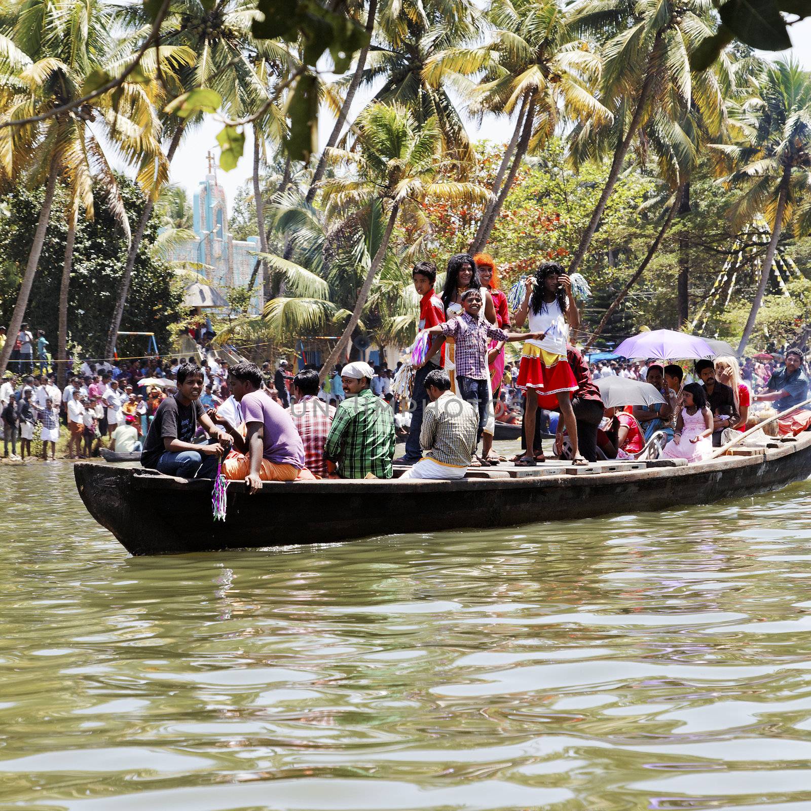 Fancy dress men in drag boat Kerala India by arfabita