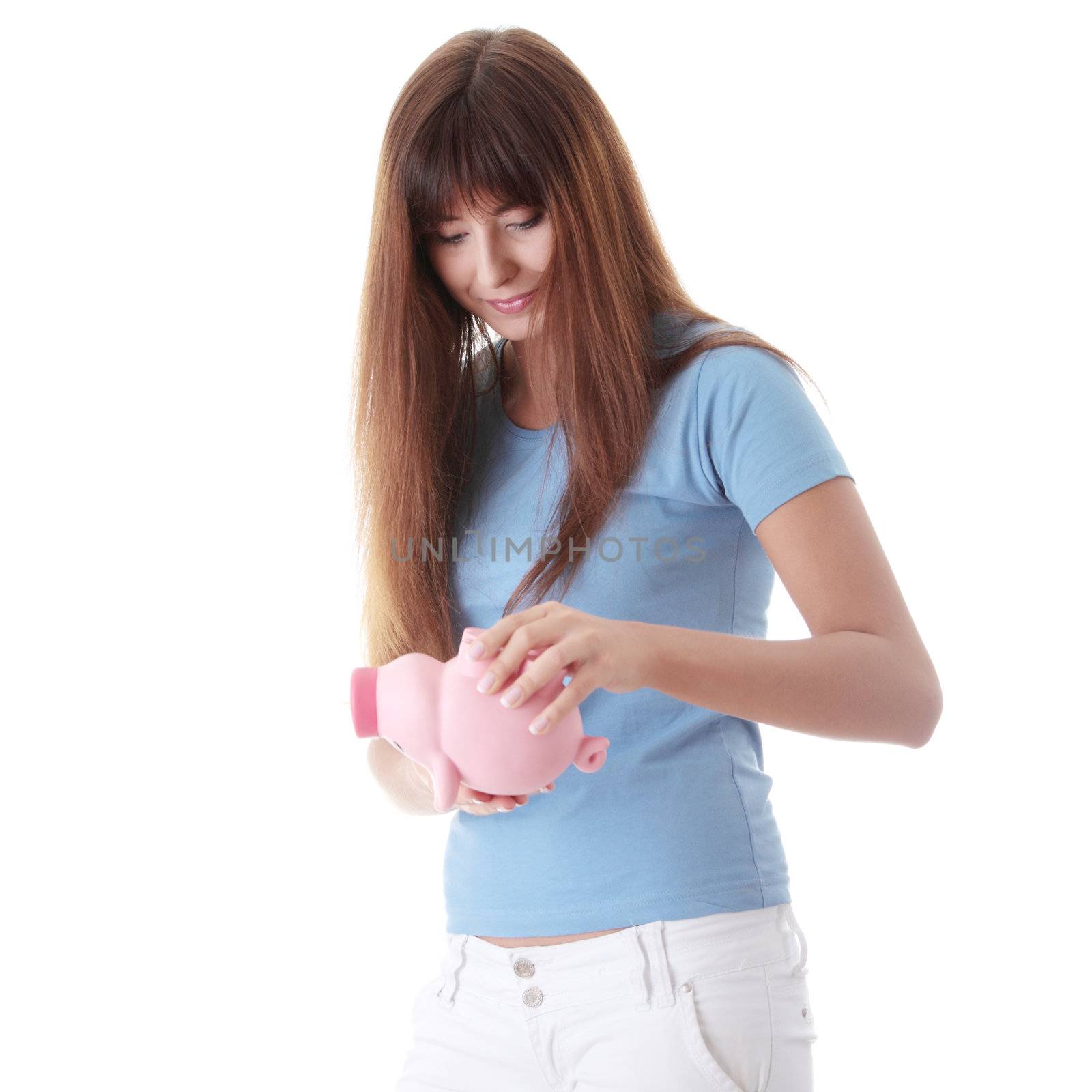 Young woman trying to get money from her piggy bank, isolated on white background