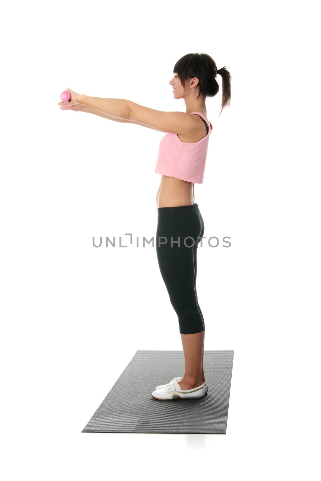 Beautiful young woman doing exercise , isolated