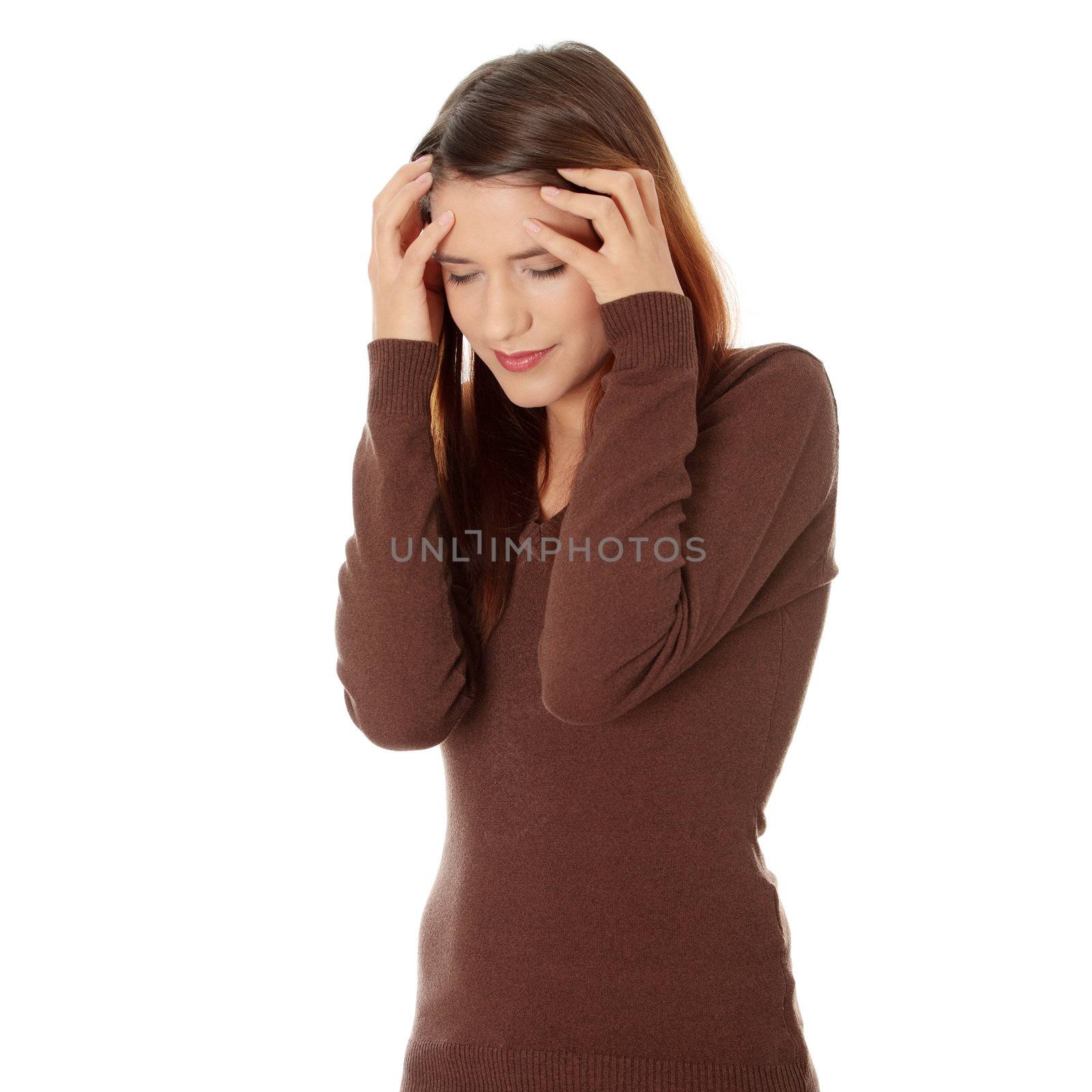 Woman with headache holding her hand to the head, isolated on white