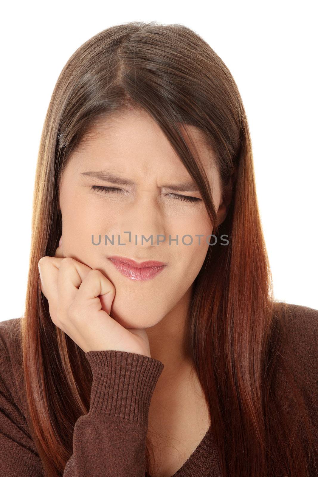 Young woman in pain is having toothache isolated on white