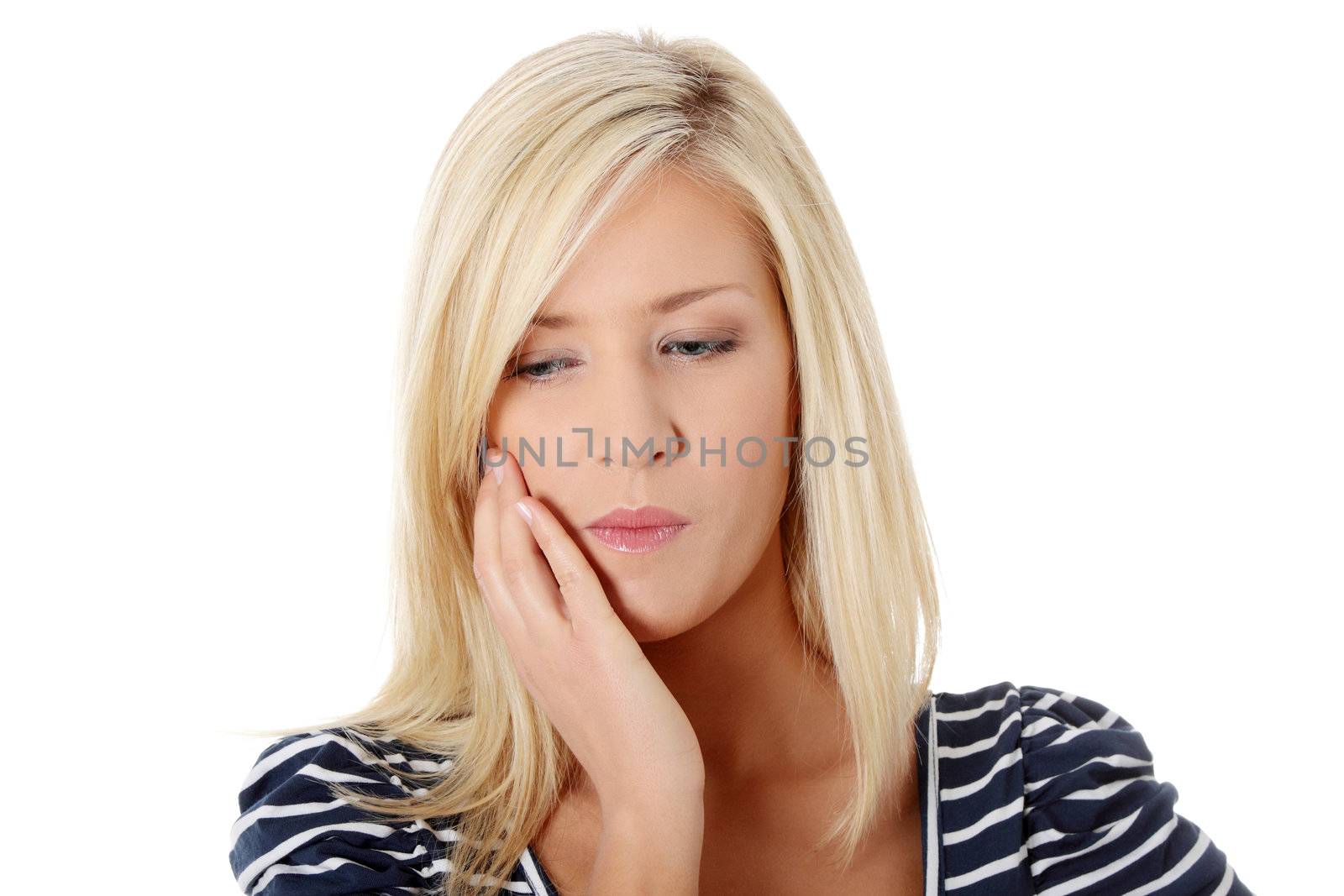 Young woman in pain is having toothache isolated on white
