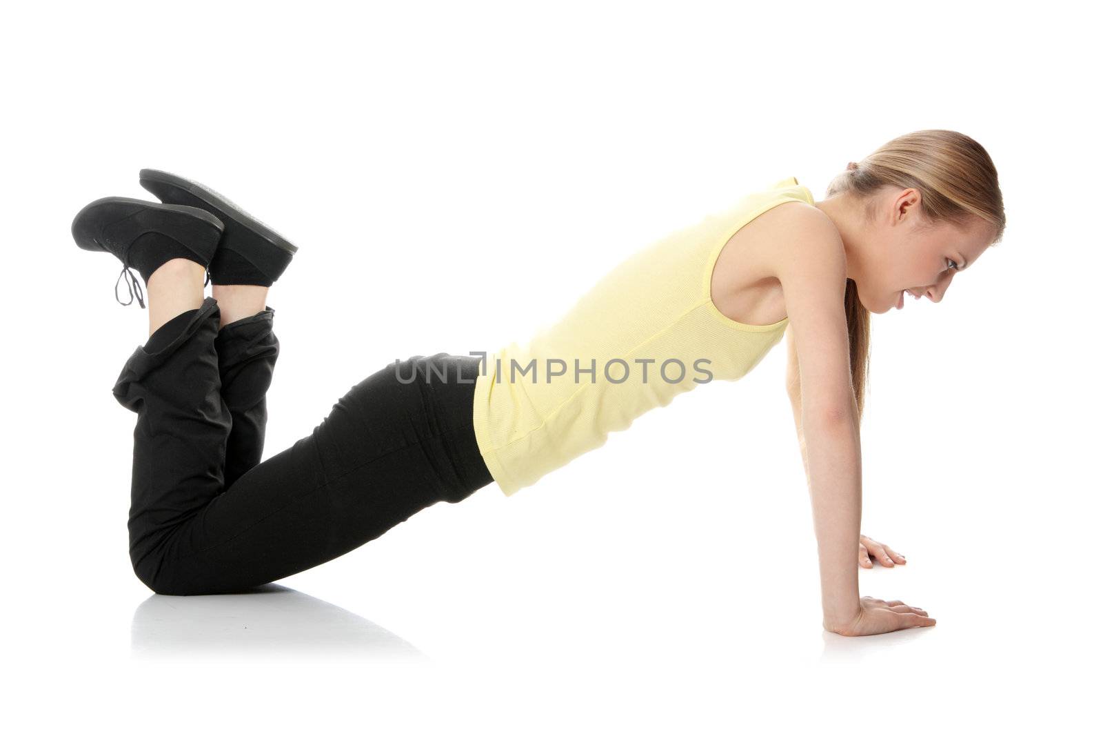 Young woman doing exercise , isolated on white