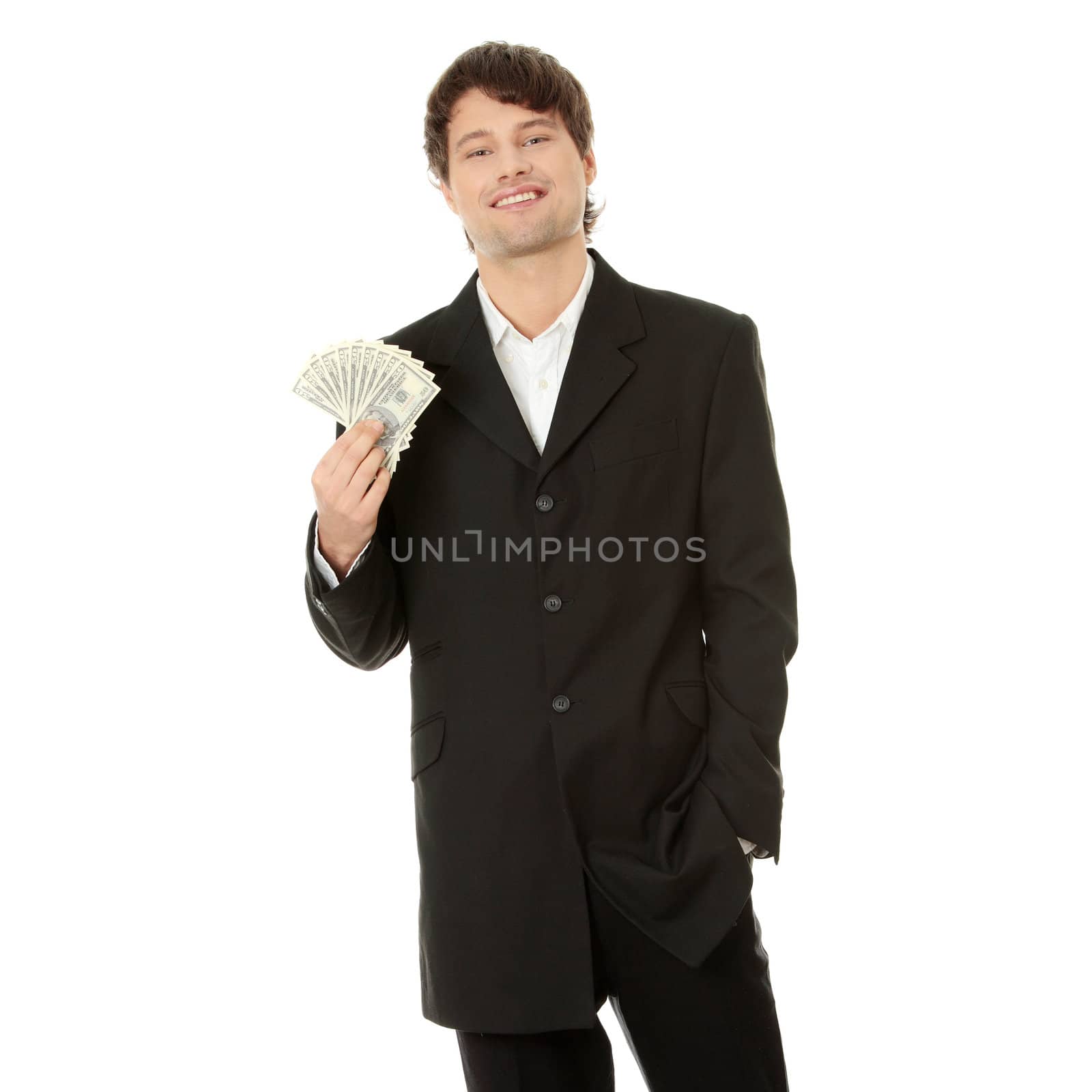 Young handsome businessman holding dollars, isolated on white