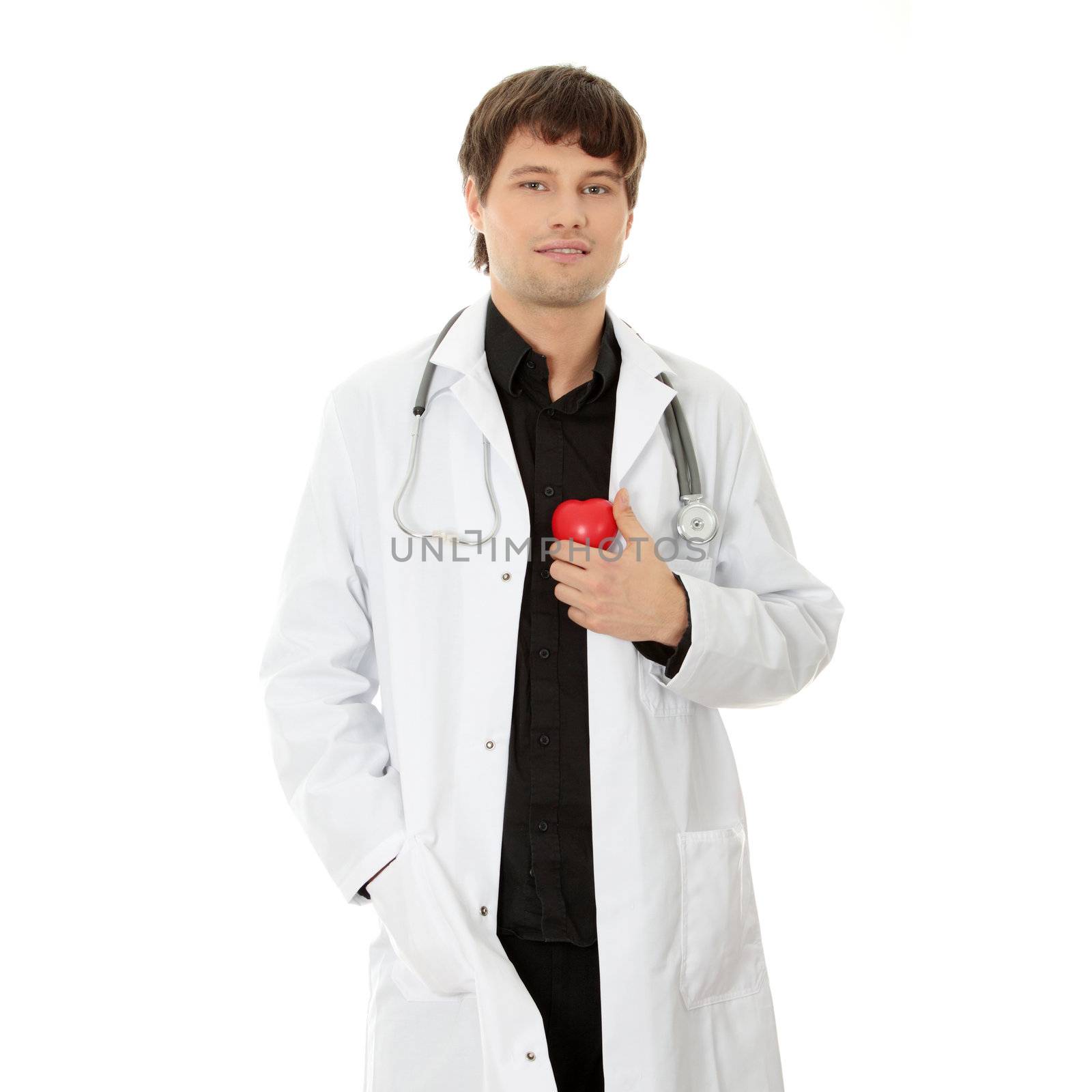 Handsome young male doctor holding heart shape toy, isolated on white