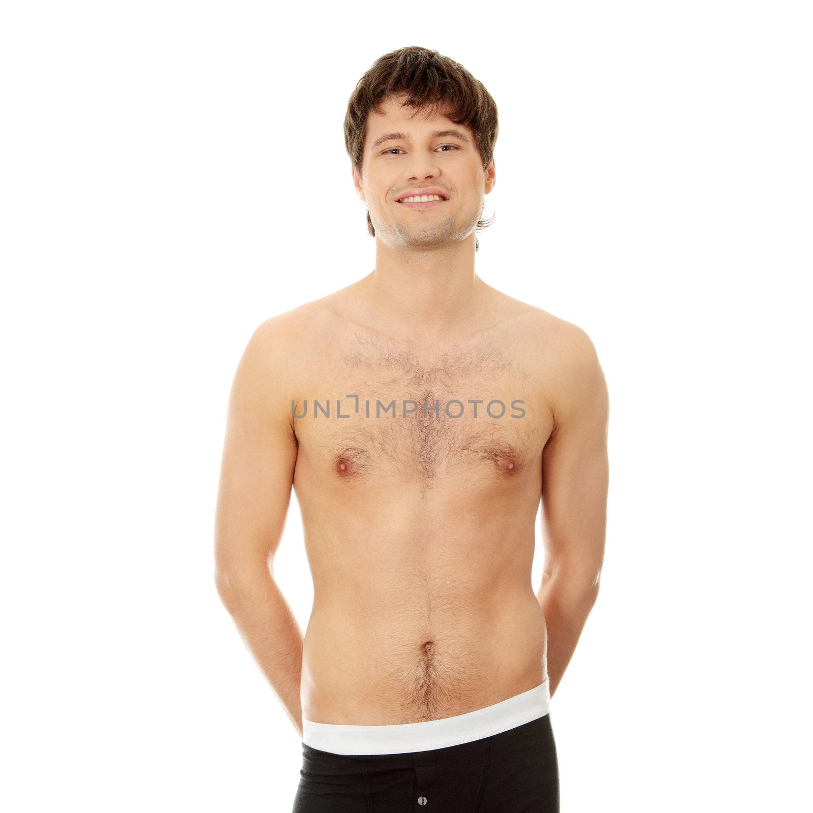 Handsome happy young man in underwear. Isolated on white
