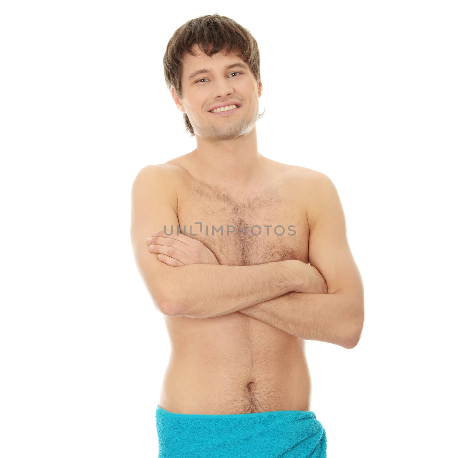 Handsome young man with the towel. Isolated on white