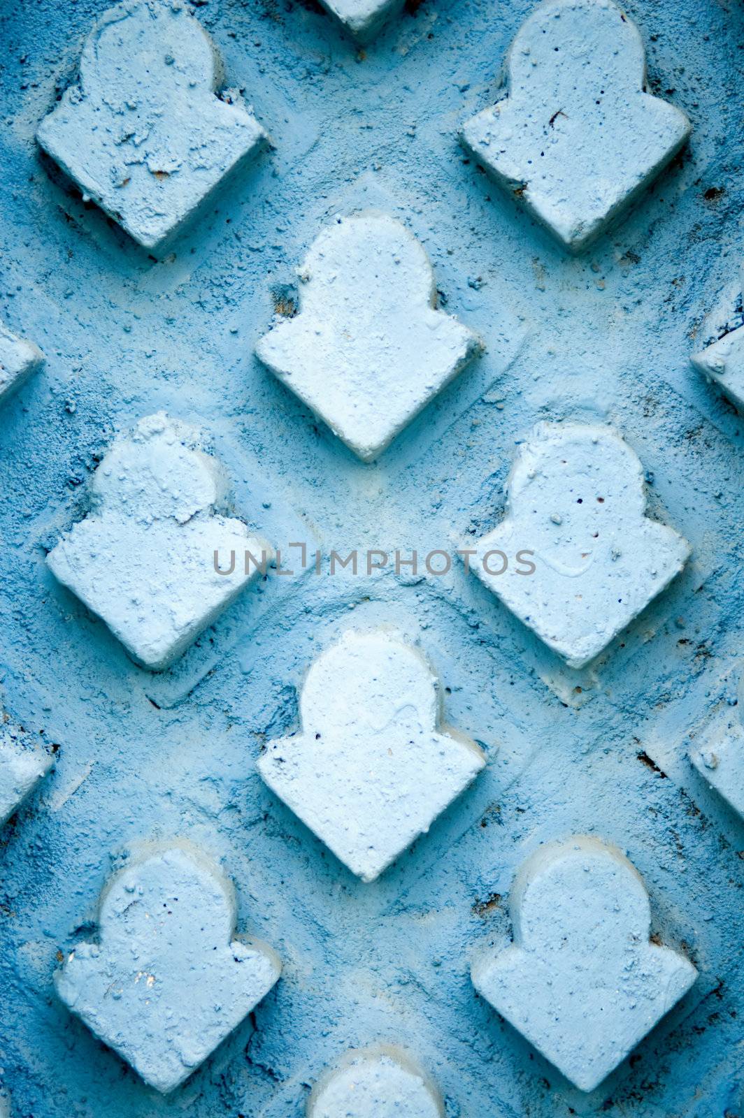 The abstract of stone wall tiled with arrows patterns 