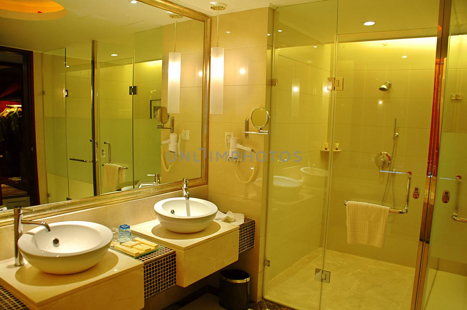 The interior of bath room with wash basin and shower