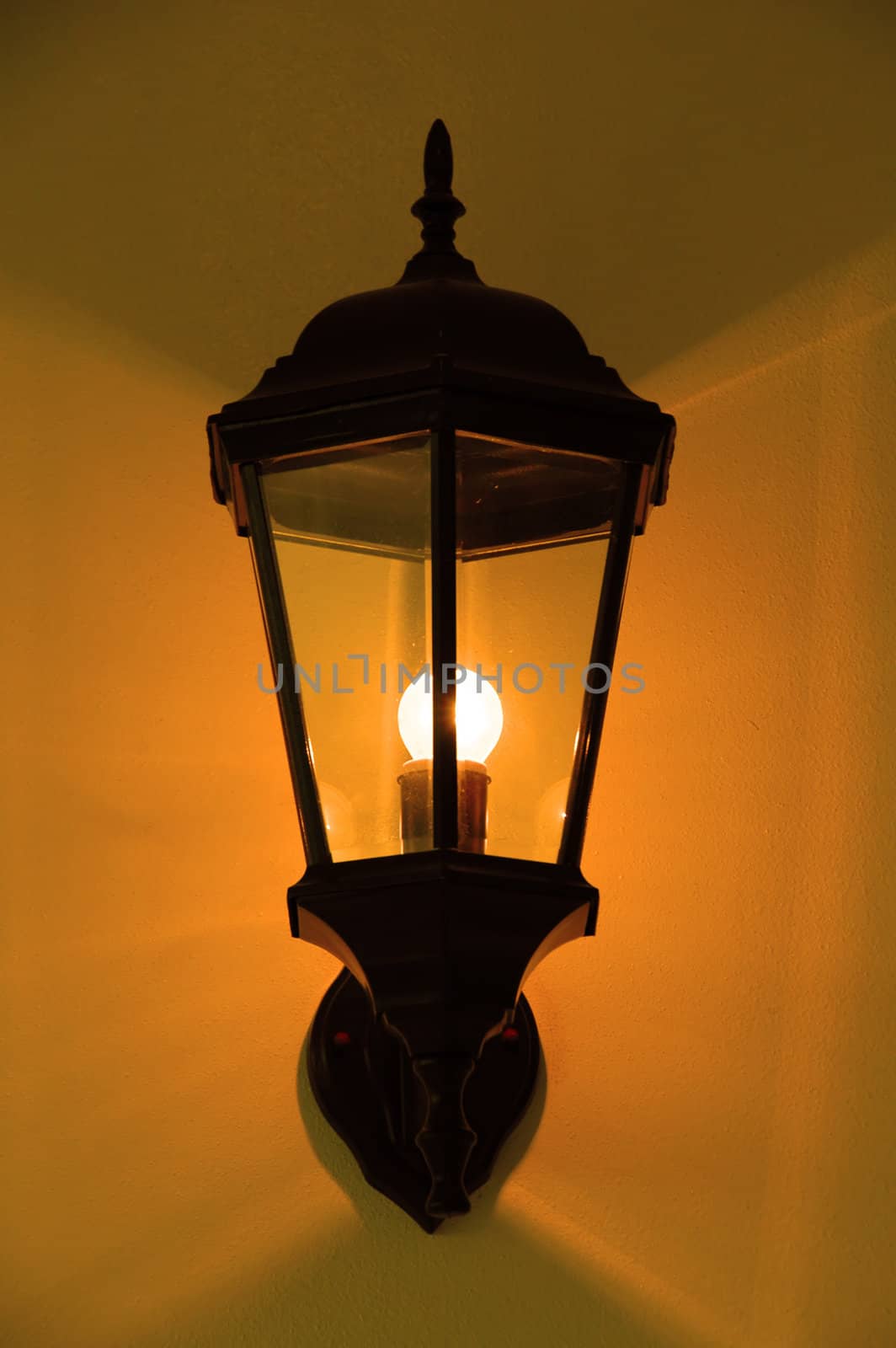 Front angle view at lamppost over blue sky