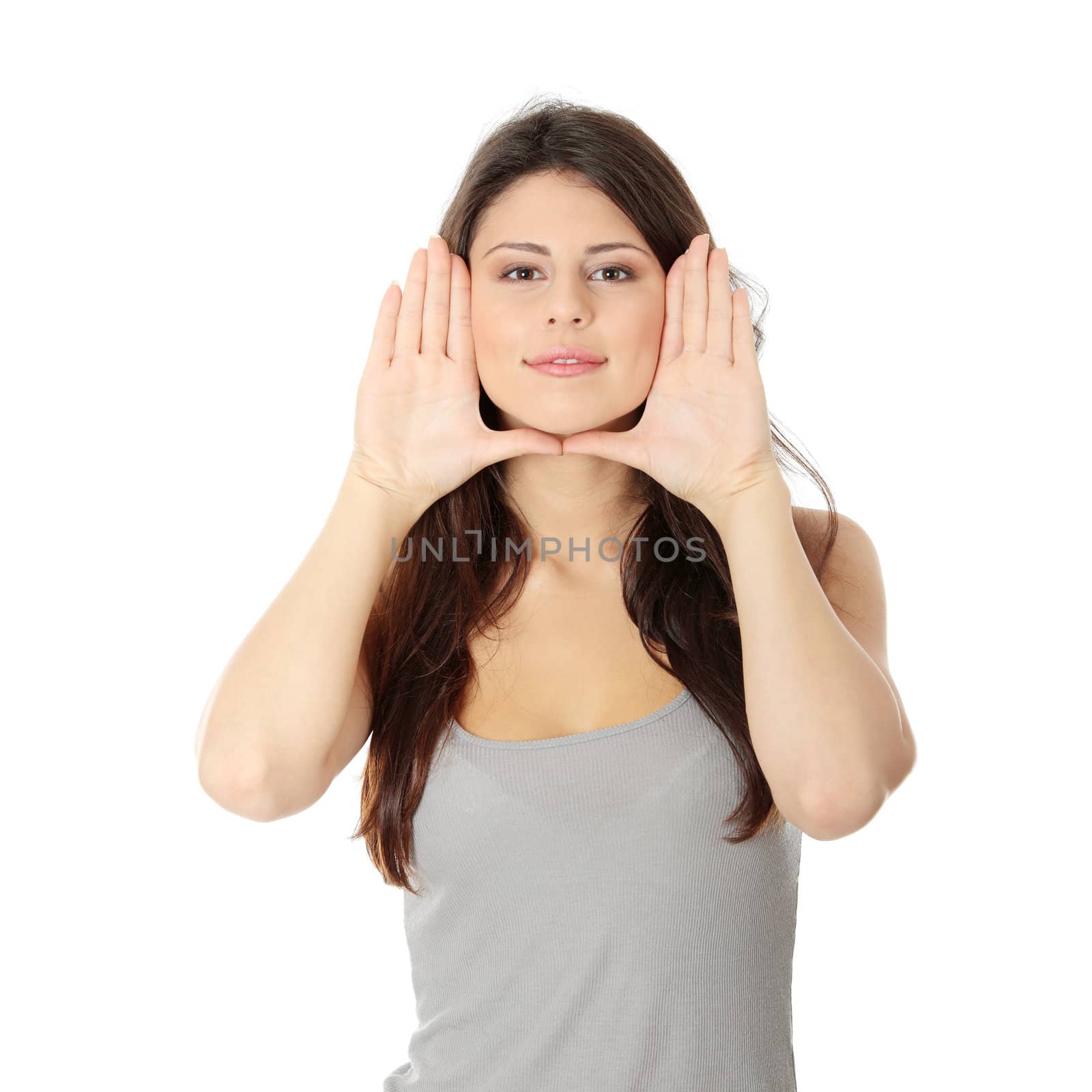 Woman framing her face with hands by BDS