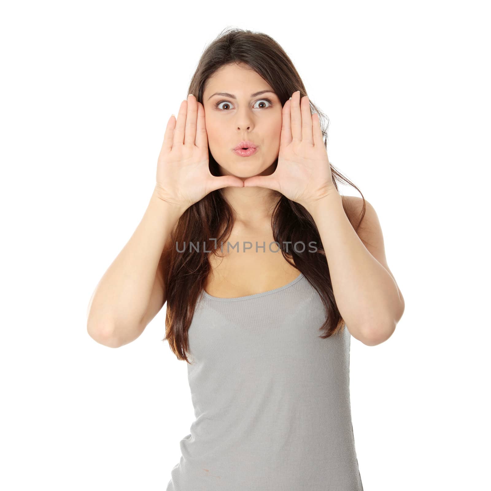 Young attractive woman framing her face with hands, over white