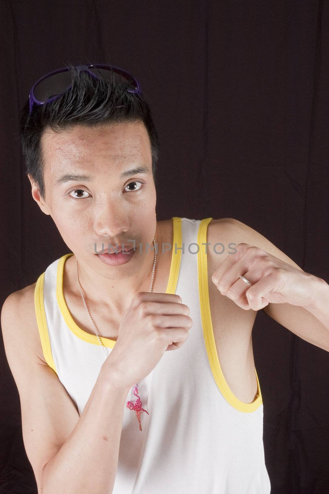 closeup of a young asian man on a black background by jeffbanke