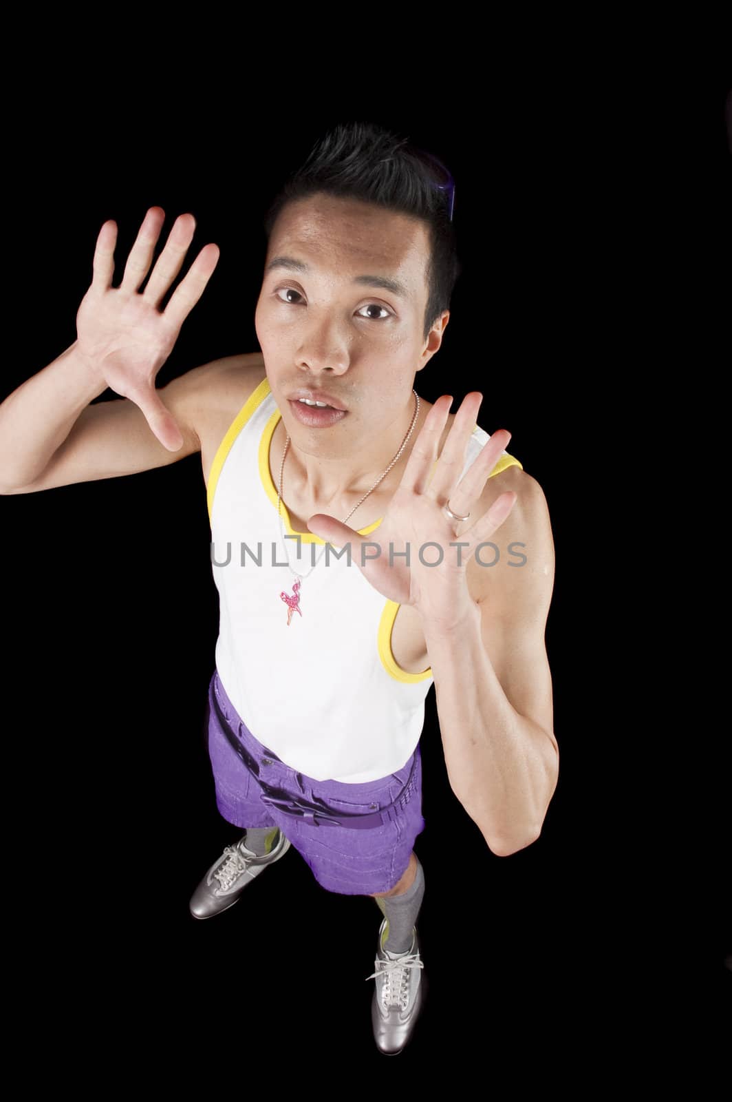 closeup of a young asian man on a black background by jeffbanke