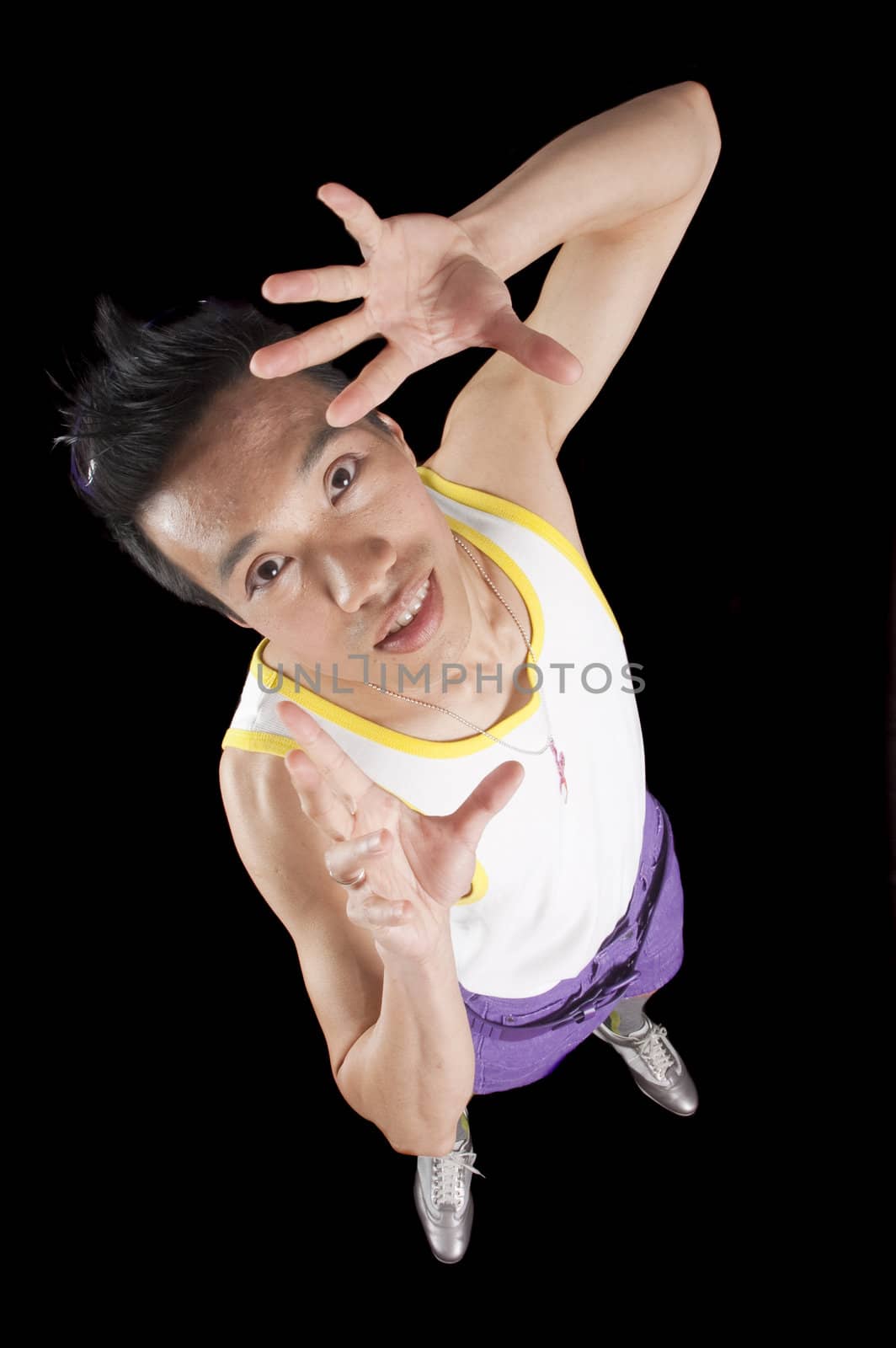 closeup of a young asian man on a black background