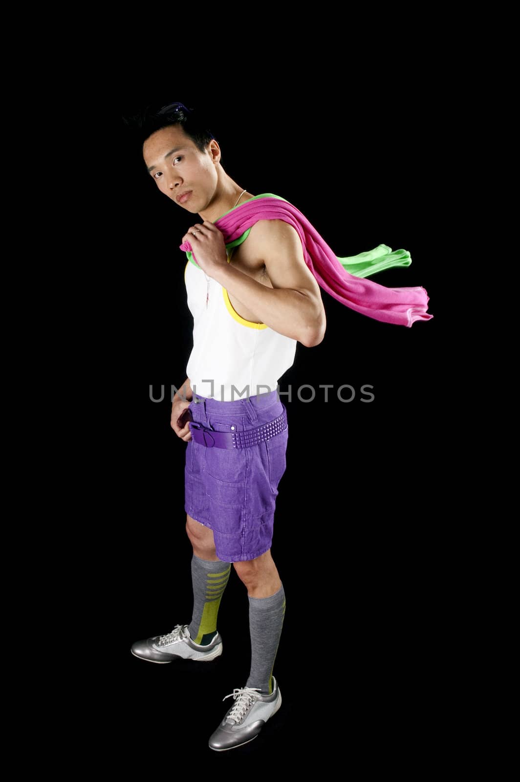 closeup of a young asian man on a black background with towel around neck