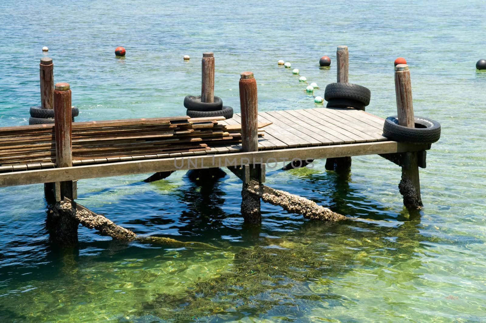 Wooden pier on tropical beach