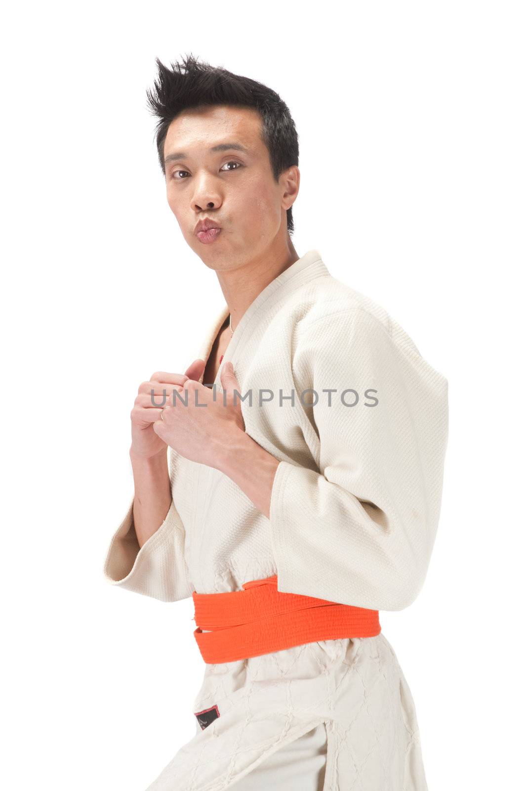 Young asian man in an Aikido, judo, Karate outfit isolated on a white background