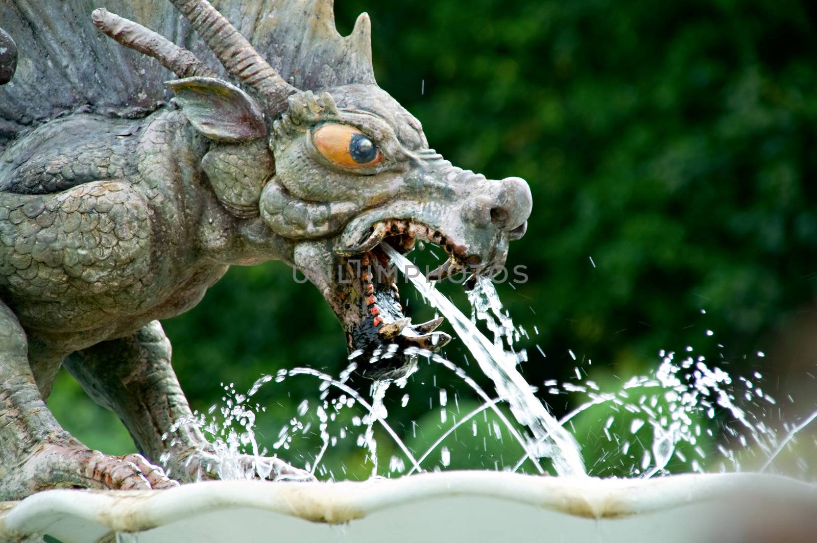 Close up of stone fountain of devil