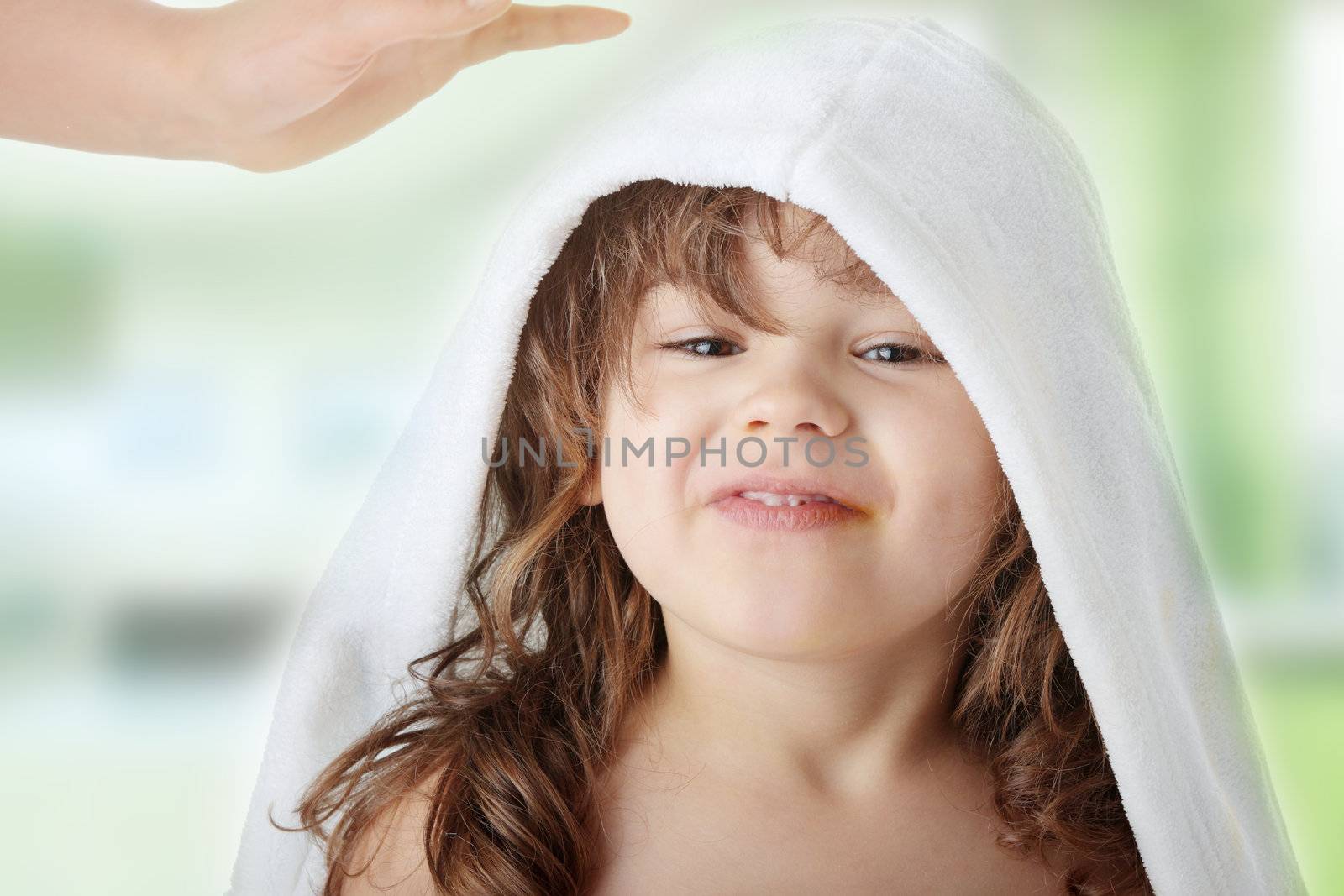 Portrait of a 5 year old girl after bath, isolated on white background