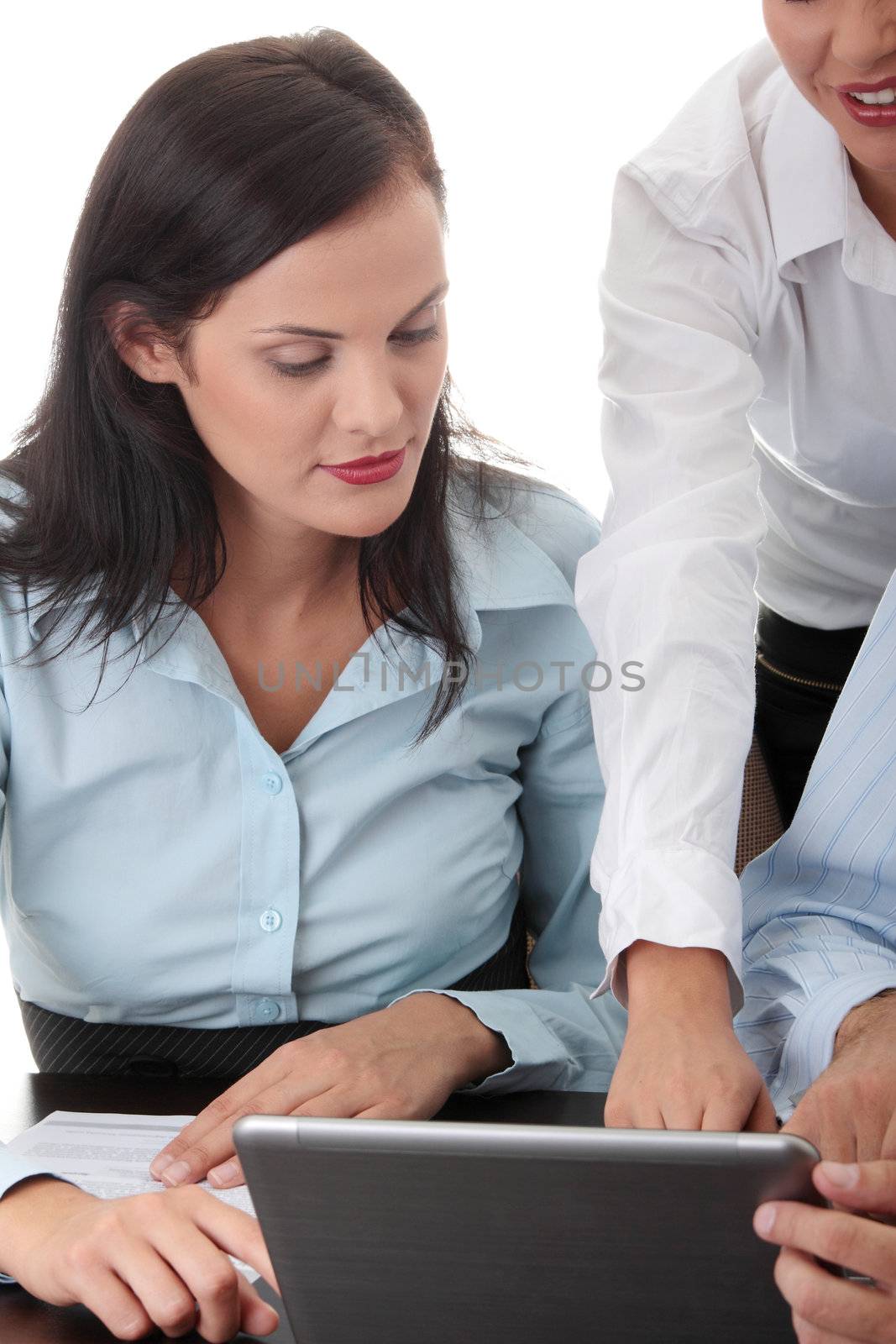 Interracial business team working at laptop in a office, isolated on white