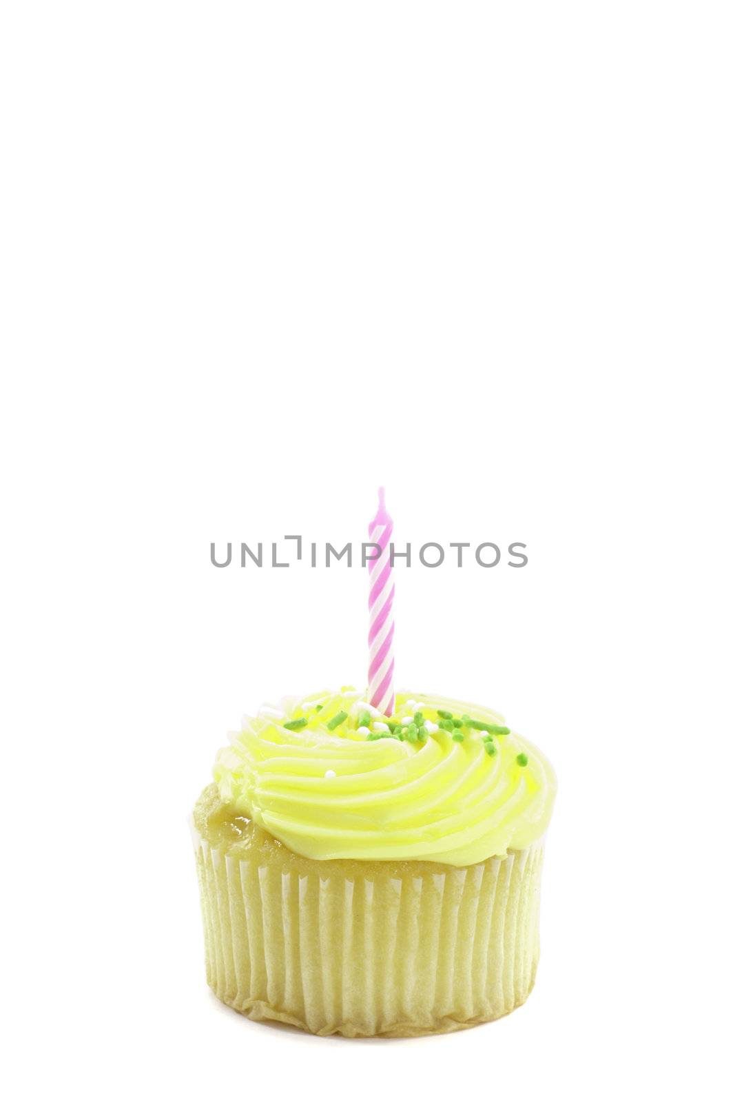 cupcake, isolated on white with a decorative candle in it