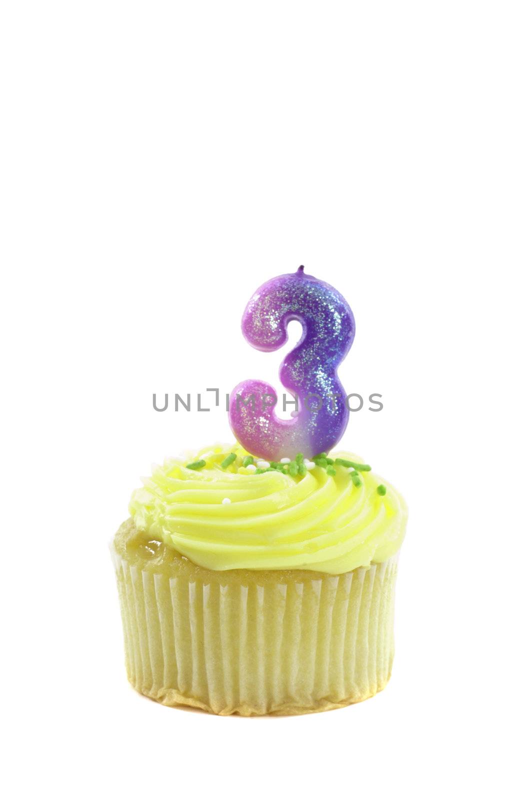 cupcake, isolated on white with a decorative candle in the shape of a number three