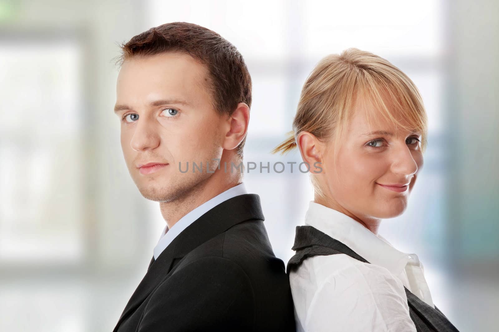 Young attractive caucasian business people in office
