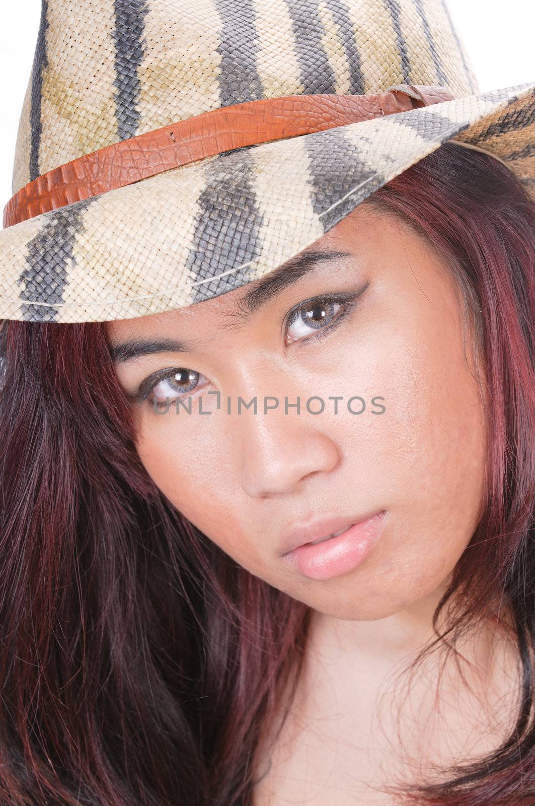 pretty asian girl with acne, wearing contact lenses in camouflage straw hat