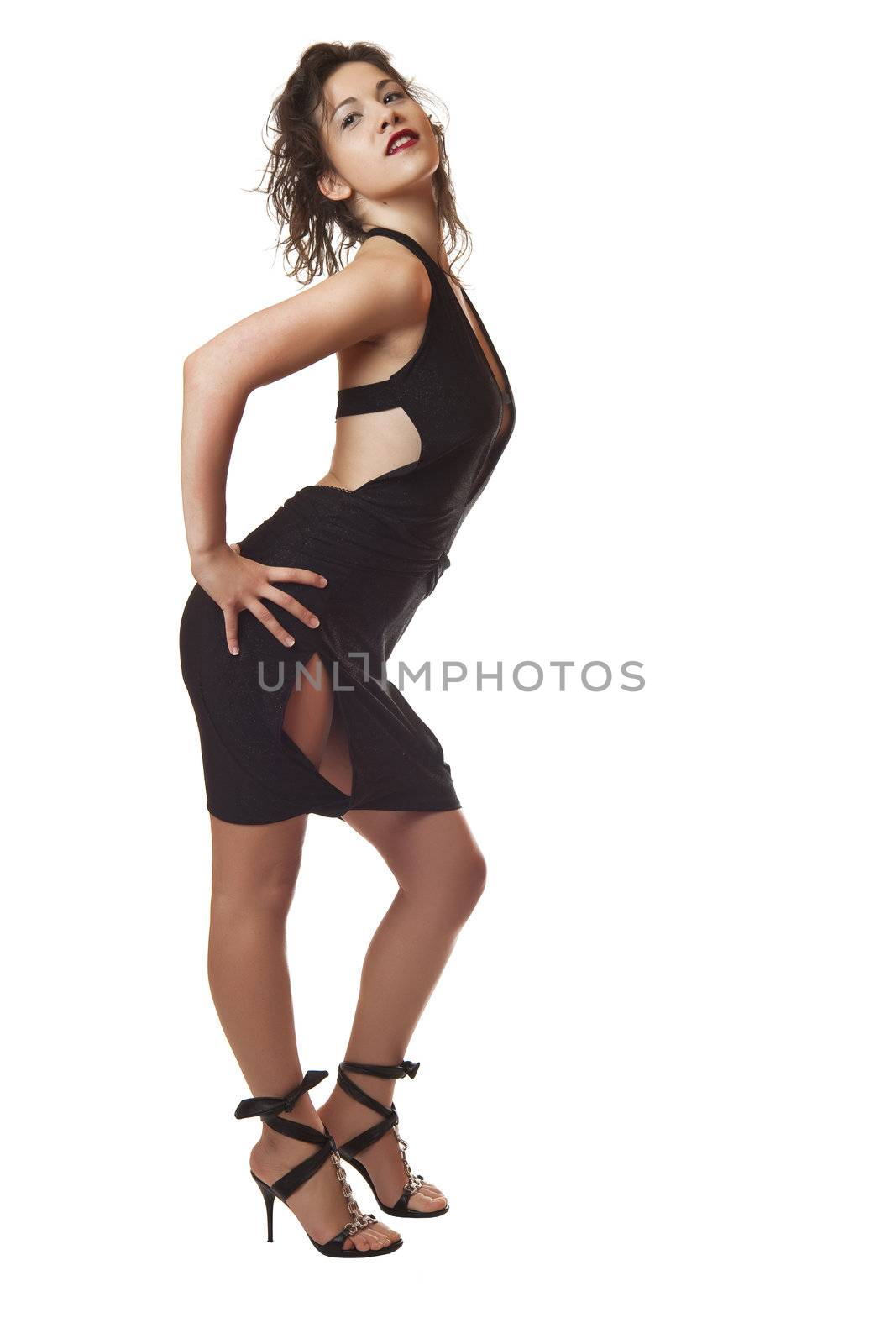 Sexy attractive young woman in black dress and high hills posing and smiling, , isolated on white background