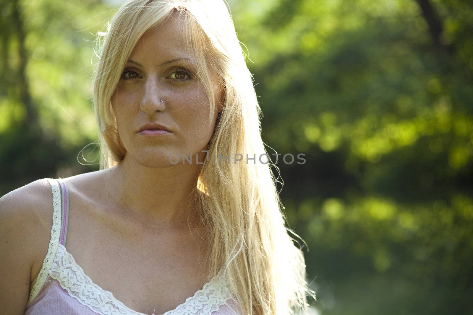 Beautiful woman resting on river, green environment