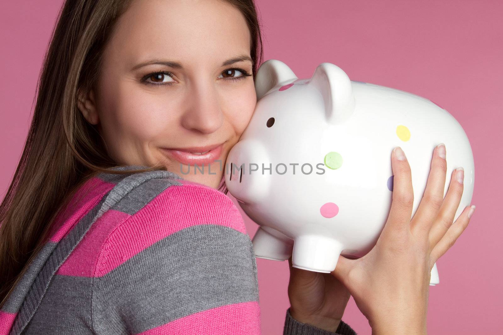 Young woman holding piggy bank