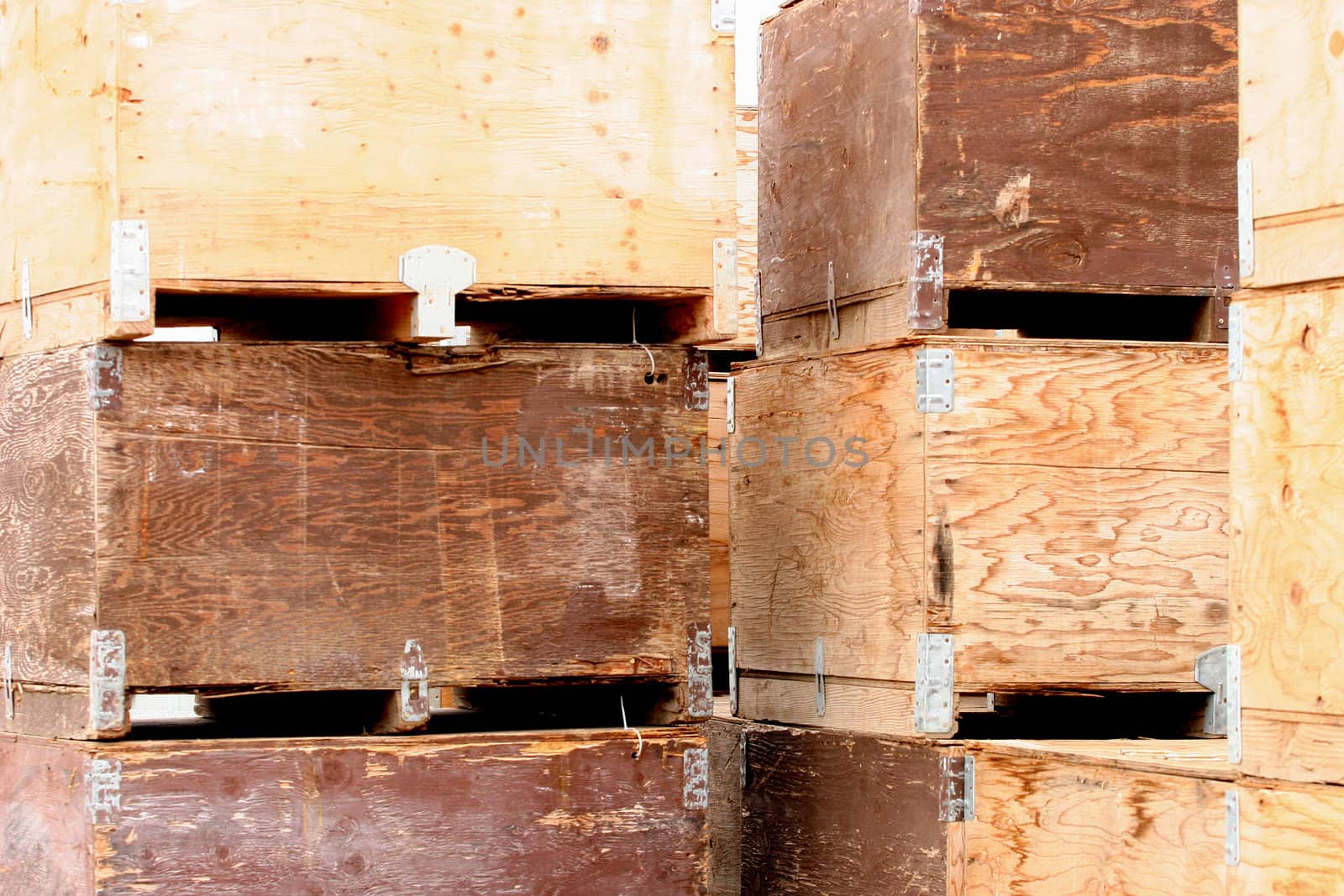 Different colors and textures of potato crates waiting for harvested potatoes