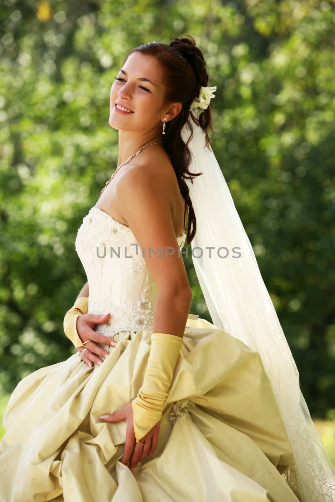Portrait of the beautiful bride in park
